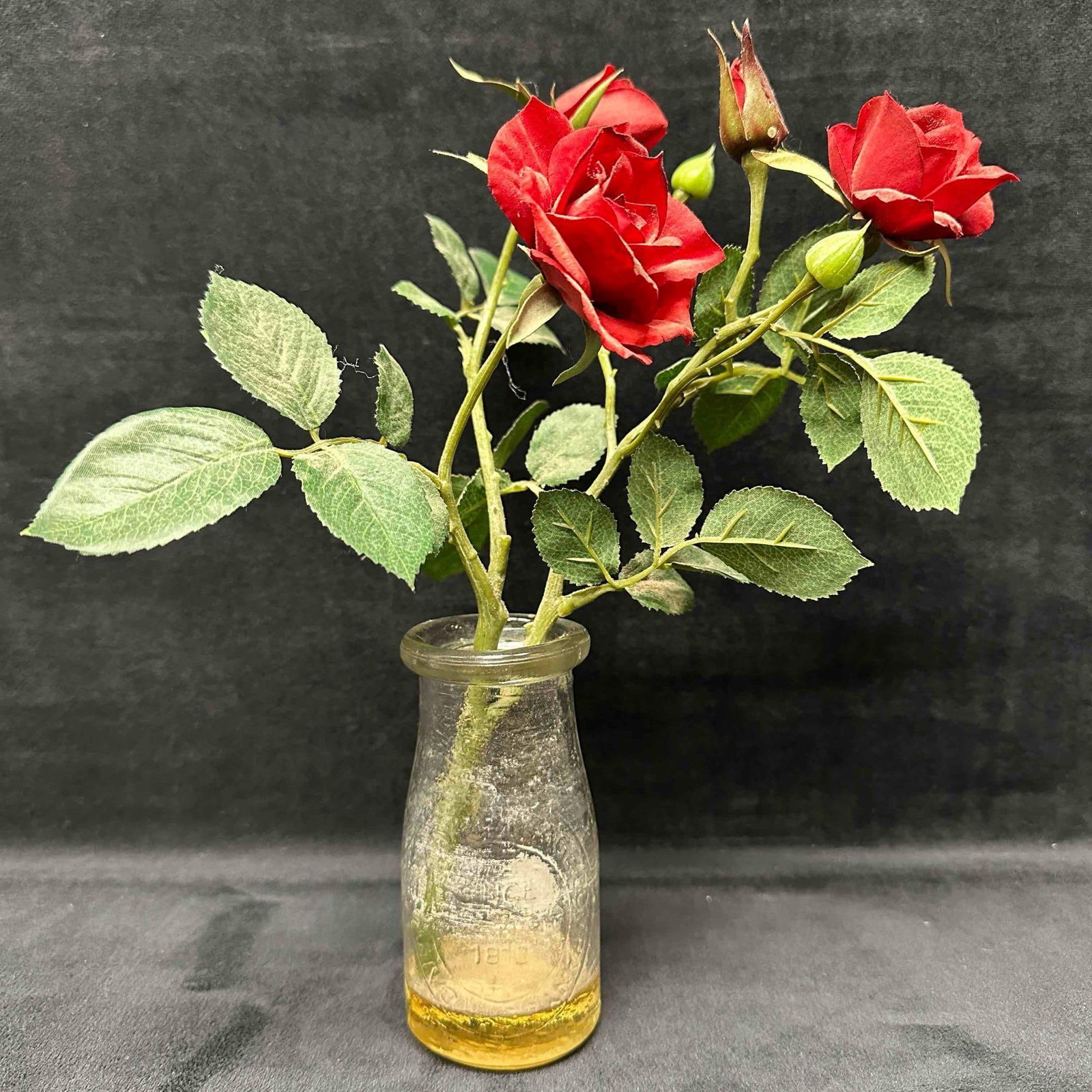 Dairy Milk By Heritage Company Half Pint Bottle Since 1810 Pebbled Glass with Faux Flowers: This item is in good pre-owned, previously displayed condition with light wear, and surface scratches. Please reference all photos for full details. Faux Flowers: 11" tall x 2 1/4" diameter. W