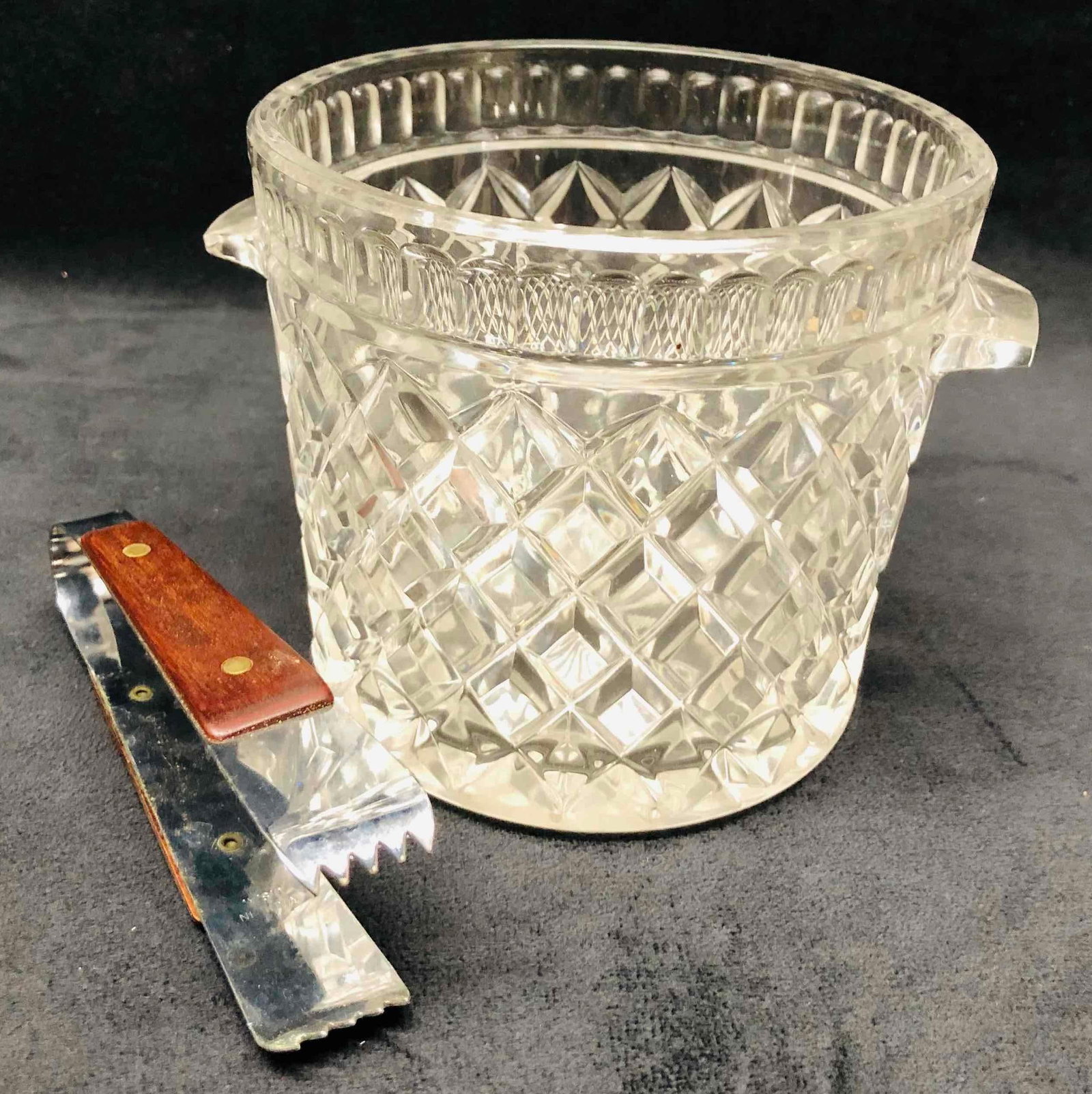 Crystal Ice Bucket & Tongs: This lot contains a Crystal Ice Bucket & Tongs. It is approx 6 3/4" x 5 1/2" x 5" and it weighs about 2.7lbs. Overall the Ice Bucket is in good used condition with some light wear from use over time. 