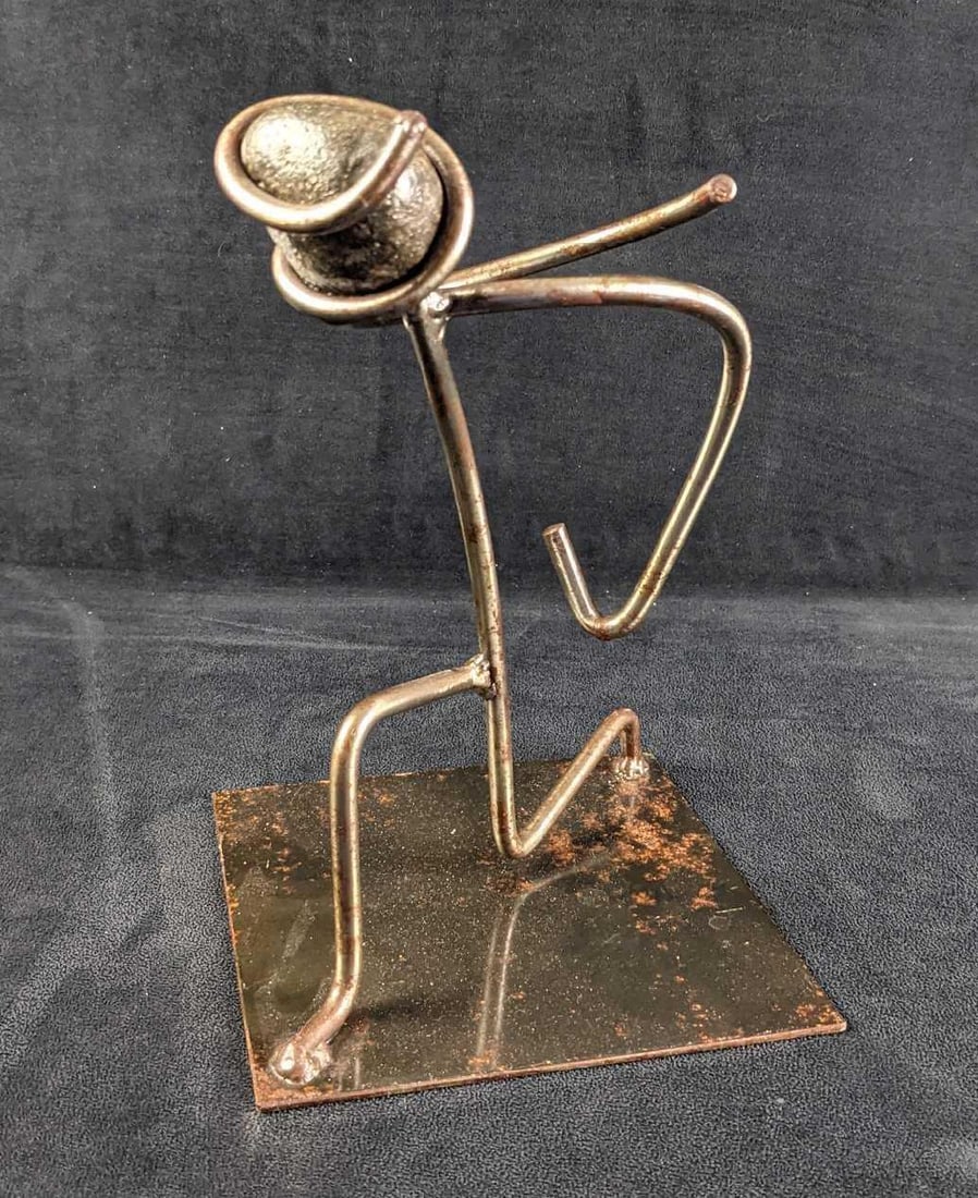 Hand-Made Metal Abstract Bowing Man Sculpture: Hand-Made Metal Abstract Bowing Man Sculpture. The maker and date of creation are unknown. Is approx 7" x 7" x11" and weighs 2.74lbs. Is in a good, vintage condition with some surface rust. Pleas