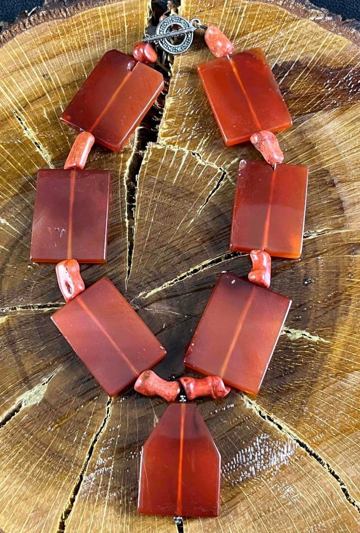 Coral Necklace made with Sterling Hardware: Coral Necklace made with Sterling Hardware This is a beautiful necklace made from coral beads and treated coral. The hardware such as the wire and clasp is sterling silver along with the small dragonf
