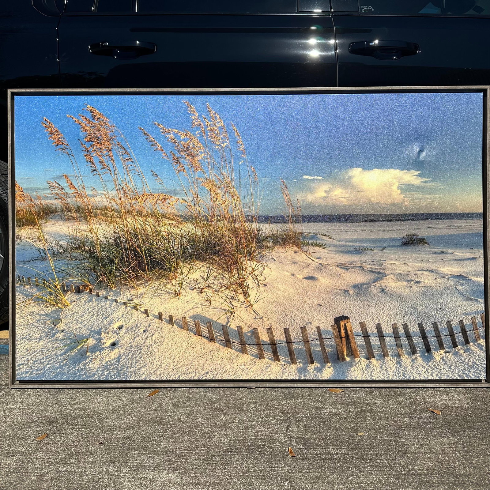 Summers End Giclee on Canvas Signed and Numbered by Cavanah 141 of 1500: Large framed giclee photograph on canvas titled Summer’s End by Cavanah. Coastal beach scene featuring dunes, sea oats, wooden fencing, and ocean horizon under a dramatic sky. Printed on canvas 