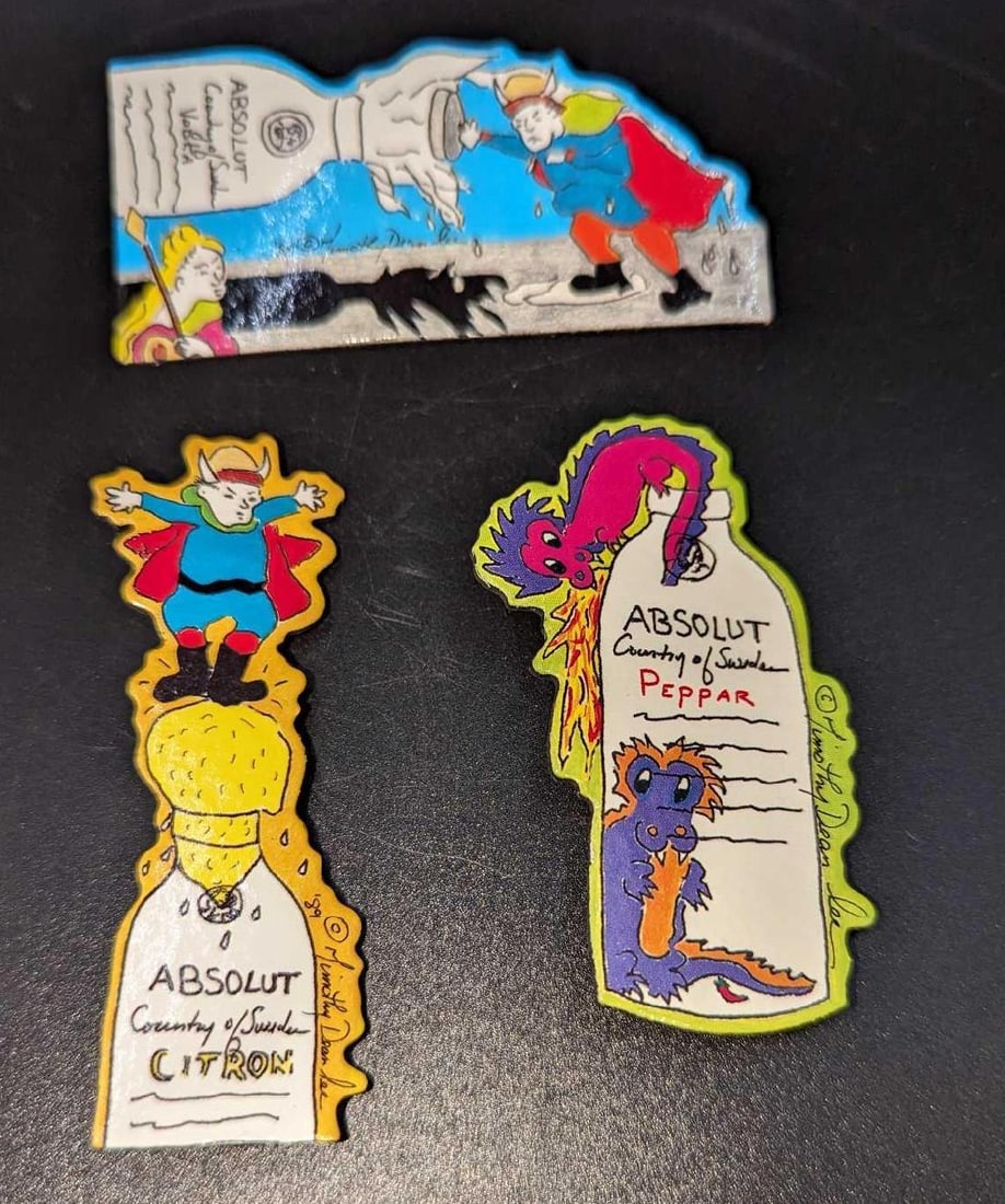3 Absolut Vodka Peppar Advertising Art Pins / Brooches E: 3 Absolut Vodka Peppar Advertising Art Pins / Brooches E. By Timothy Dean Lee. Each is made of a Laminated Art Board. This was released from the year 1990 to the year 1991. The set is approx 1 5/8"x