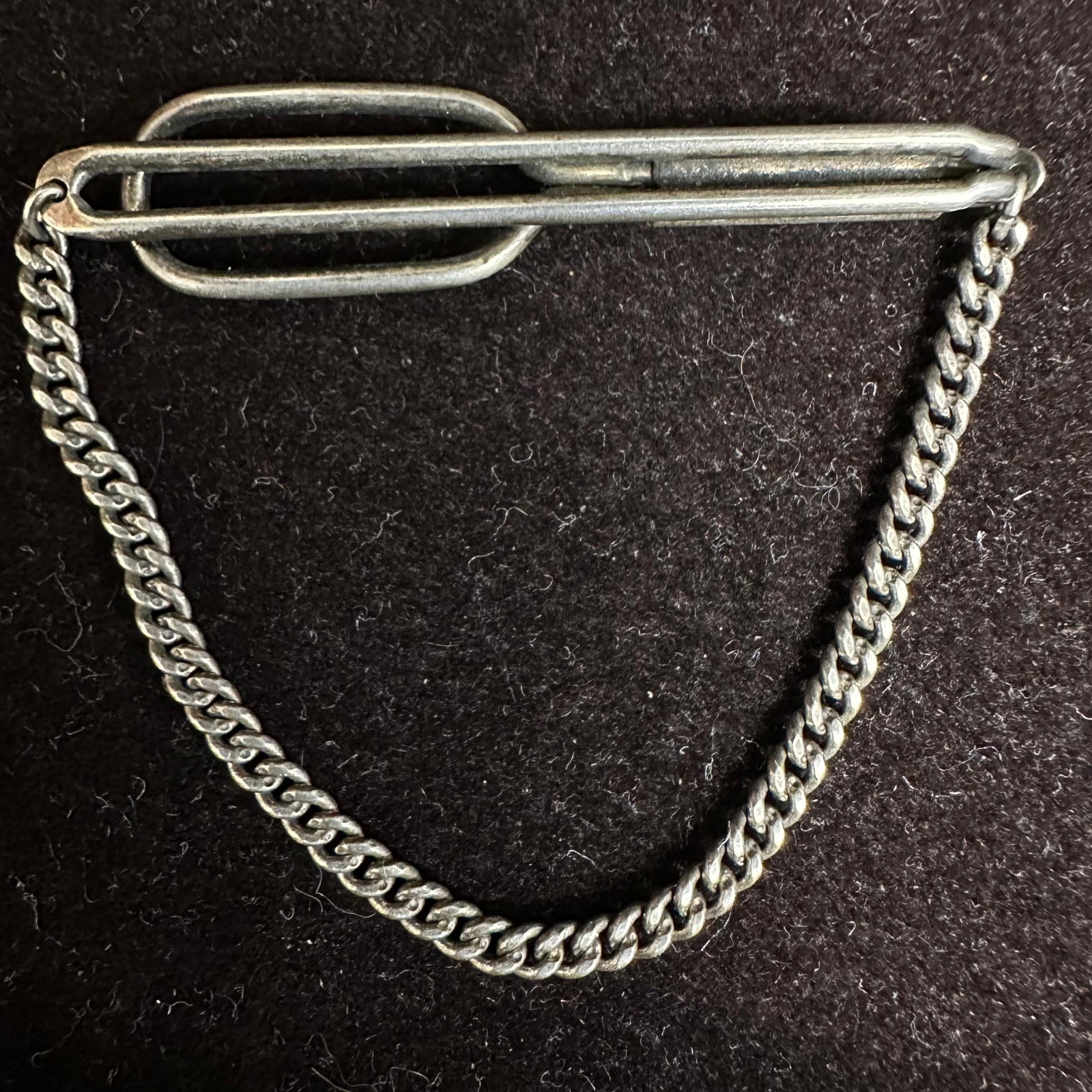 Swank Sterling Silver Vintage Tie Clip with Chain: This item is in good pre-owned, previously used/displayed condition with noticeable light wear and surface scratches. Please reference all photos for full details. This piece of jewelry has been teste