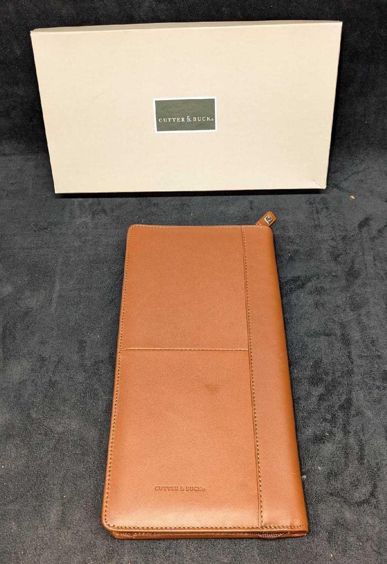 Cutter and Buck Brown Leather Zip Around Auto Organizer: Cutter and Buck Brown Leather Zip Around Auto Organizer. The organizer comes in its original box that is approx 12" x 6 1/2" x 1 1/2" and it weighs 0.93lb. There is some light wear on the