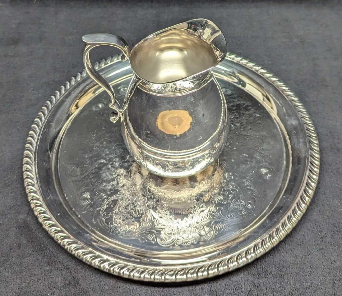 Vintage Silverplate Platter And Creamer Pitcher: Vintage Silverplate Platter And Creamer Pitcher. This lot includes: (1) Reed & Barton 967 Silverplated Creamer Pitcher. This is approx 5" x 4" x 5 1/4". The pitcher has scratches. (1) 