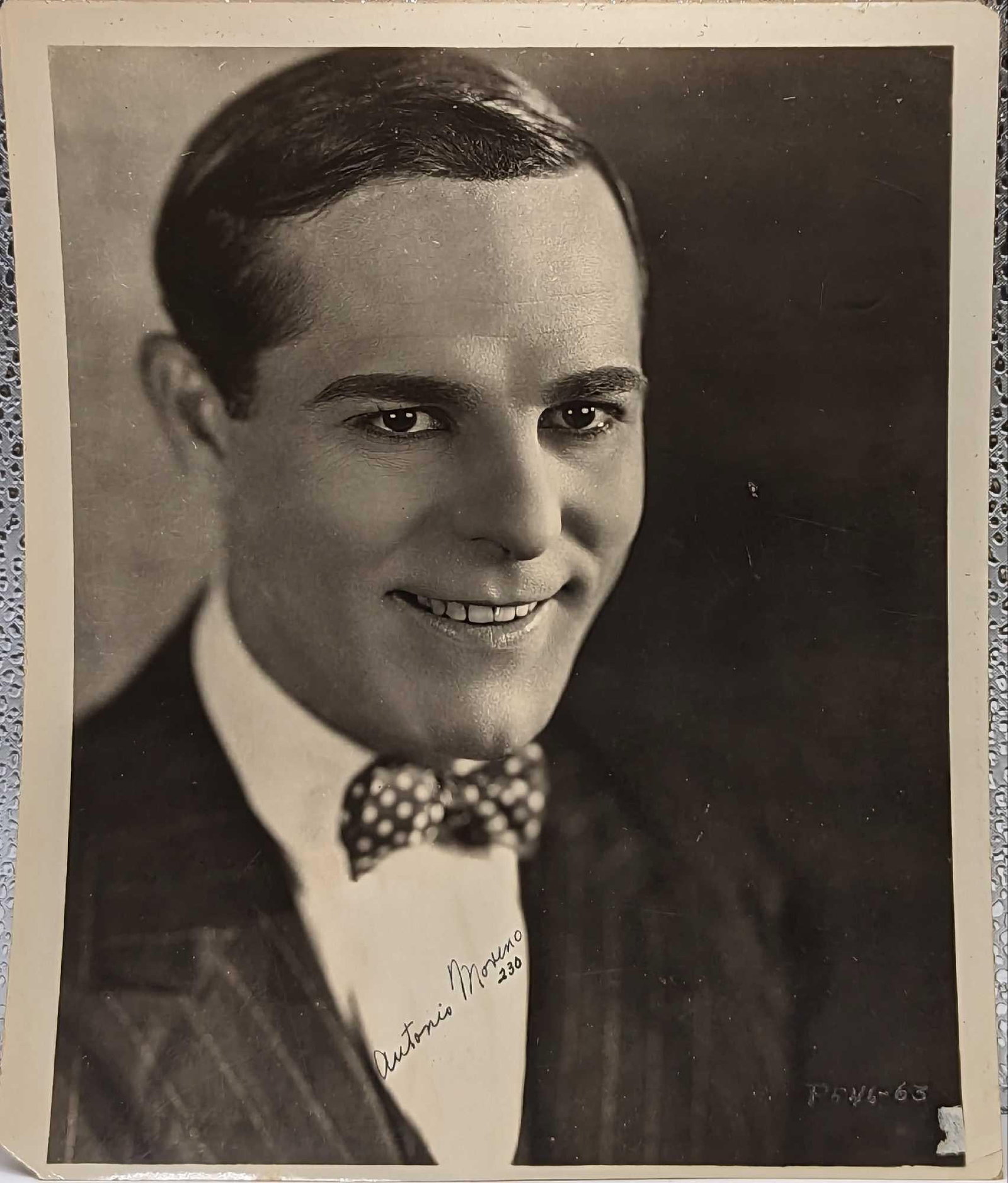 Antonio Moreno Autographed Publicity Photo: Antonio Moreno Autographed Publicity Photo. This is approx 8" x 9 3/4" and it weighs 0.02lb. The photo's corners are either creased or missing and there are light scratches and