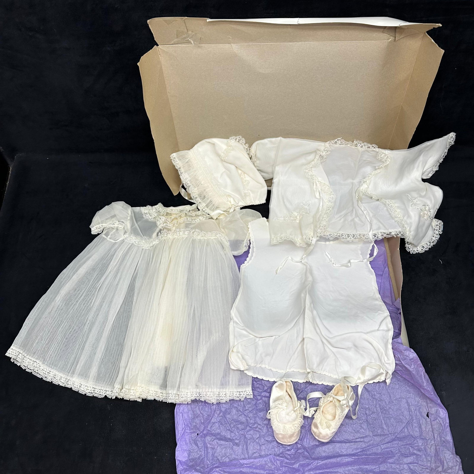 Vintage Baby Christening Outfit Set Dress Bonnet Slip and Booties: Baby baptism or christening outfit set, presented in original storage box. The set includes an overlay dress with trim, a matching underdress, a bonnet, and a pair of soft booties with ribbon