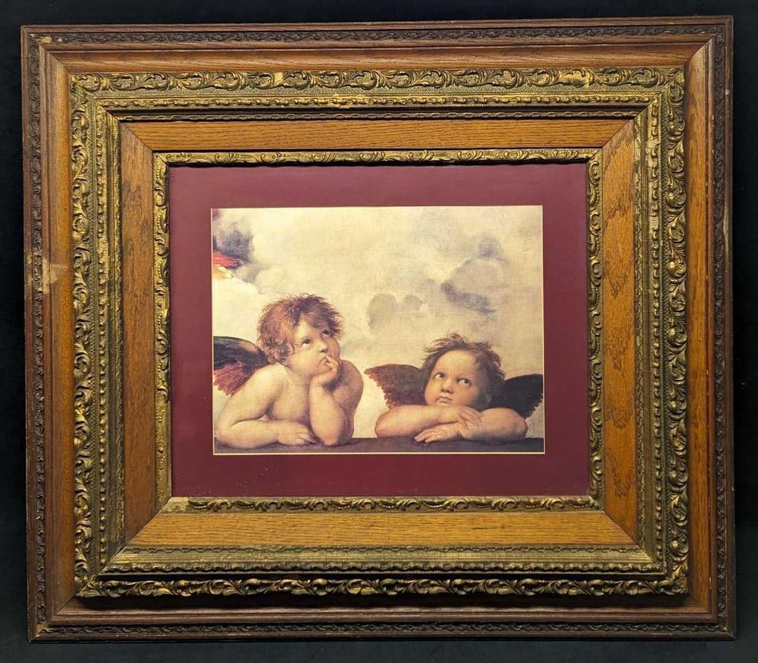 Framed Raphael Two Cherubs Print: Framed Raphael Two Cherubs Print. The framed print is approximately 33 3/4" x 1 3/4" x 29 1/4" and it weighs 13lbs. Please note, that the print was not signed by the artist. The frame has some