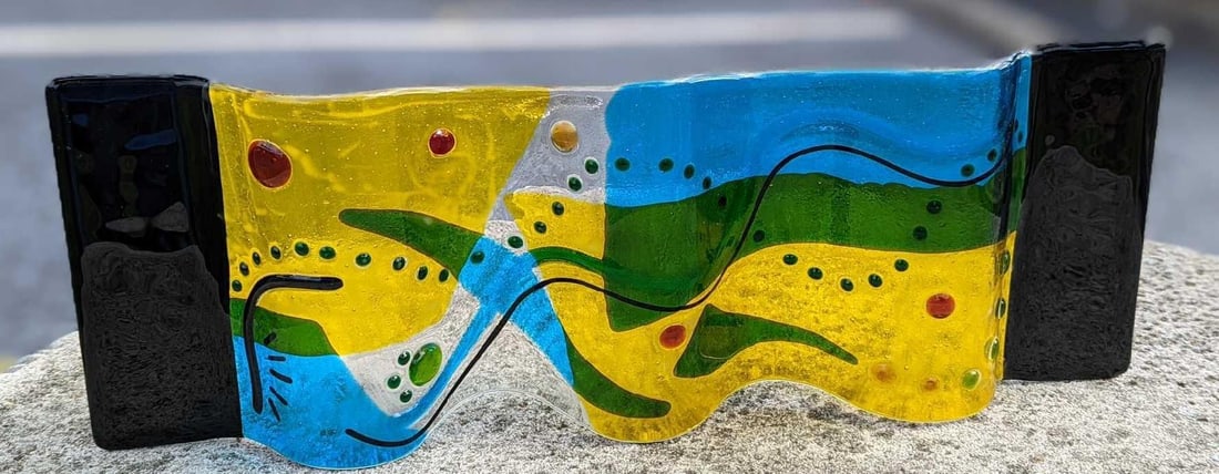 Colorful Curved Free Standing Fused Glass Art Panel: Colorful Curved Free Standing Fused Glass Art Panel. The maker and date of creation are unknown. Is approx 23" x 4" x 8" and it weighs 4lbs. This glass panel was created by fusing multiple layers