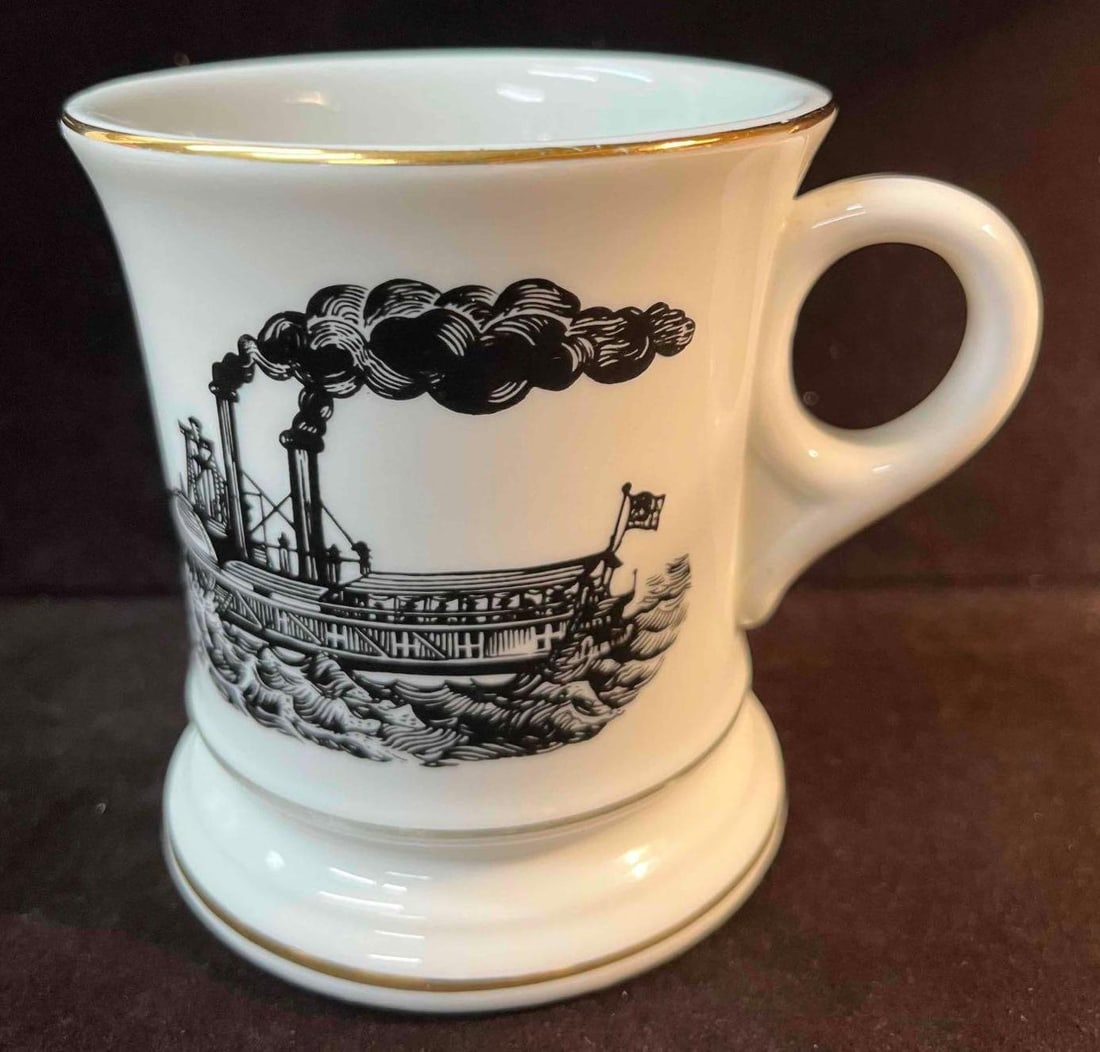 Vintage Steamboat Mustache Mug: This lot contains a Vintage Steamboat Mustache Mug. Marked 6707 on the bottom. It is approx 3 1/2" x 3 1/2" x 3 3/4" and it weighs about 0.5lbs. Overall the Mug is in good used condition with som