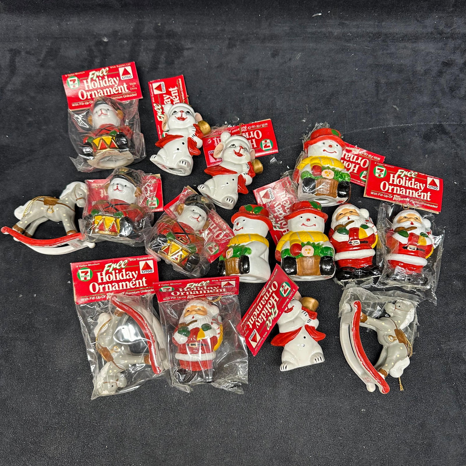 7 Eleven Citgo Holiday Ornament 90s Series Christmas Fifteen: Various holiday ornaments were offered in the 1990s, featuring Santa, a Snowman, a Teddy Bear, and more holiday-themed items. 15 fifteen total. These items are in good pre-owned, previously displayed 