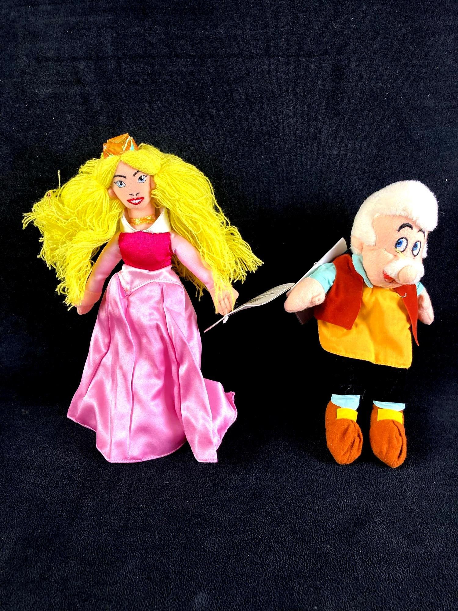 Set of (2) Disney Plush Bean Bag Dolls Princess Aurora and Gepetto: Up for auction is a recent estate find, a pair of (2) Disney plush bean bag dolls in particular Princess Aurora from Disney's film Sleeping Beauty and Gepetto from Pinocchio. They came from a