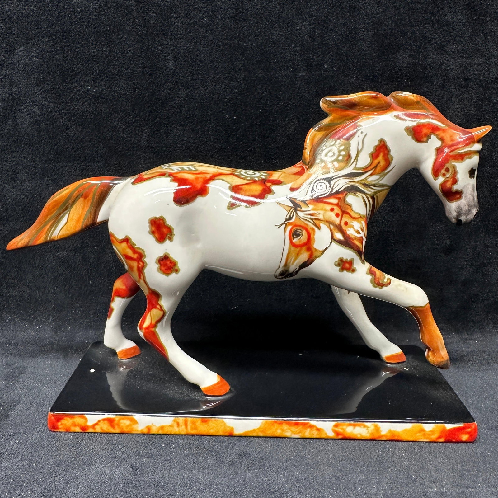 The Trail Of Painted Ponies Petroglyph Pony Figurine By Lynn Bean: The Petroglyph Pony figurine from The Trail of Painted Ponies collection designed by artist Lynn Bean. Features stylized horse and Native American inspired petroglyph motif decoration in orange tan an