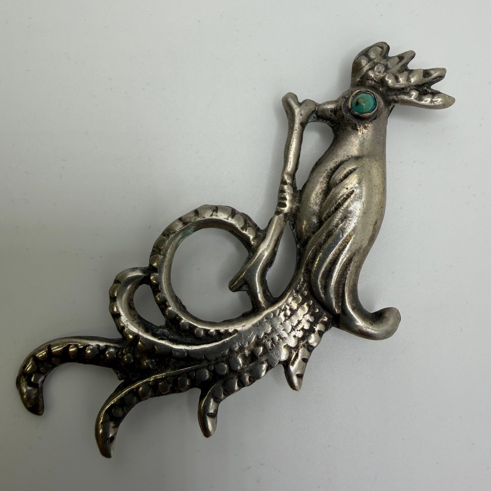 Mexico Silver Bird of Paradise Turquoise Eye Brooch: This item is in good pre-owned, previously used/displayed condition with noticeable light wear and surface scratches. Please reference all photos for full details. This piece of jewelry has been caref