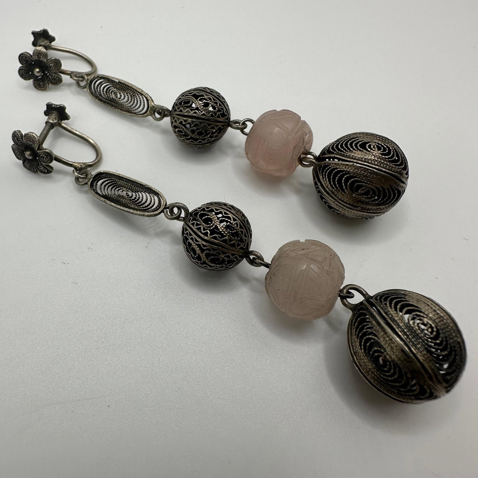 Floral Screw Back Dangle Silver Earrings Carved Pink Stone Filigree Silverwork: This item is in good pre-owned, previously used/displayed condition with noticeable light wear and surface scratches. Please reference all photos for full details. This piece of jewelry has been teste