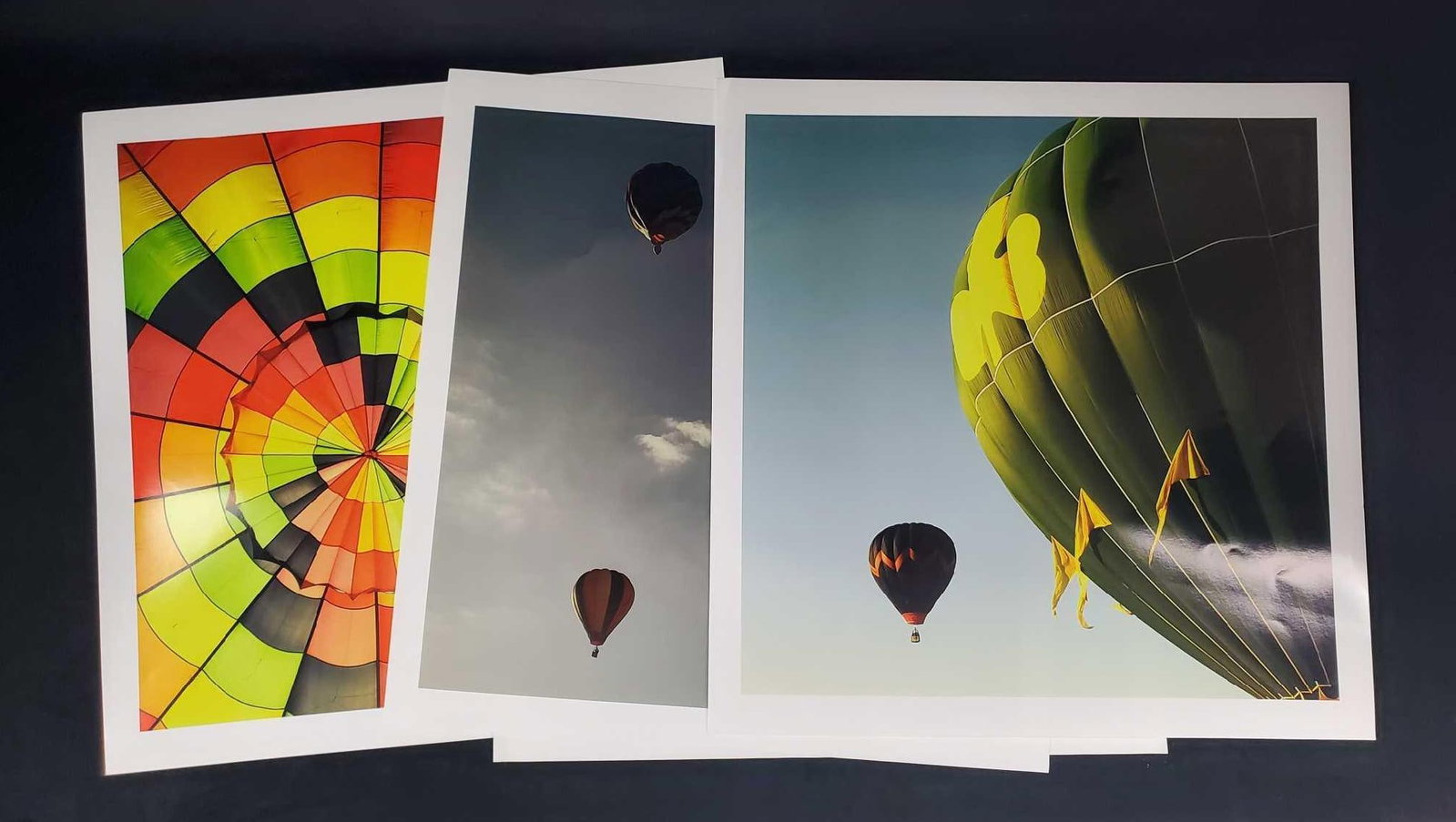 Large Colorful Hot Air Balloon Photos Lot Of Four: This lot includes three very glossy and professionally shot photos that have white borders and are approx 20" x 20". Pictures are all in good, used condition with some light storage wear/bendi