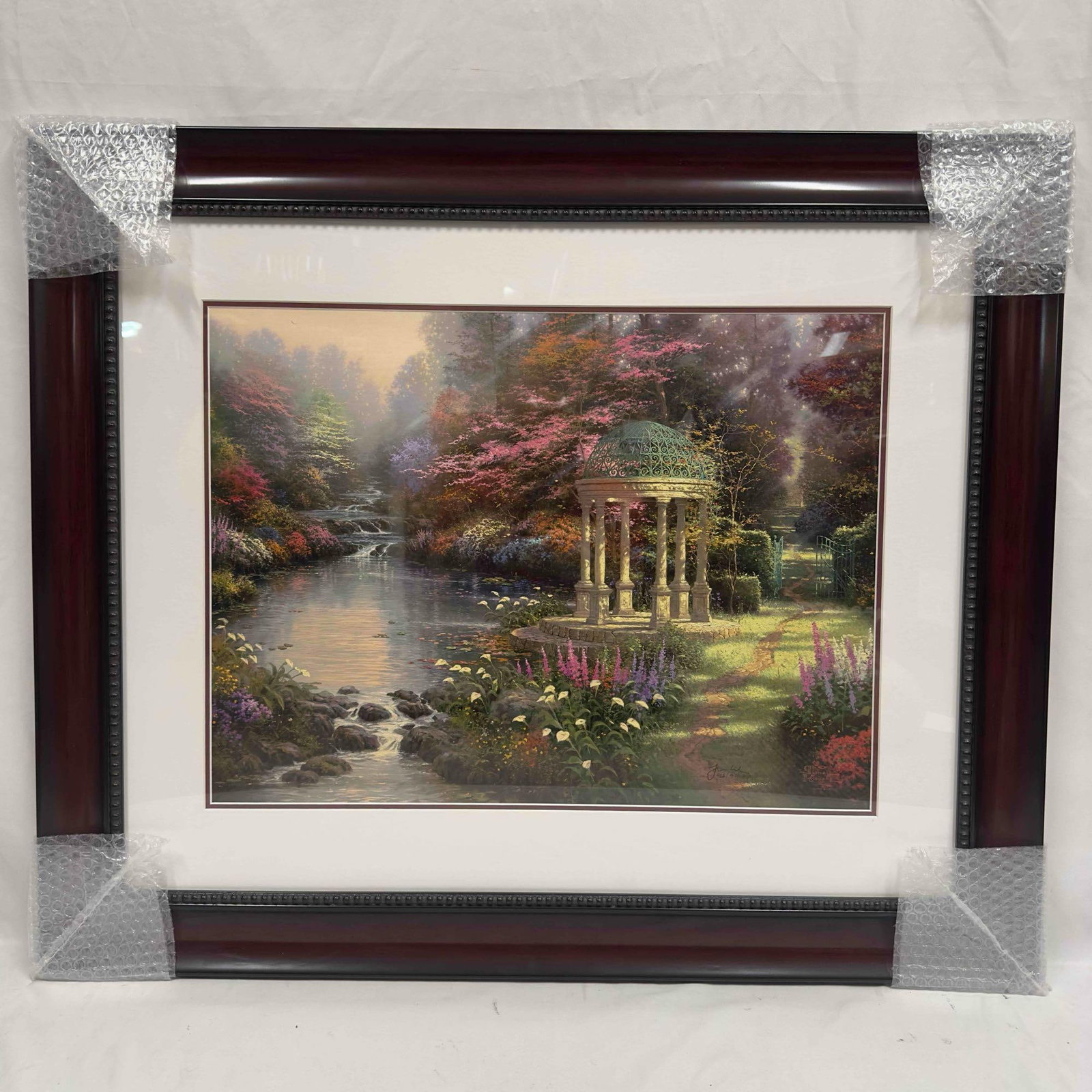 Thomas Kinkade Garden of Prayer Small Lithograph Framed: Thomas Kinkade Garden of Prayer Small Lithograph Framed. Offset lithograph in color on premium paper. Signed with the artist's DNA matrix signature authentication system. Includes original Park We
