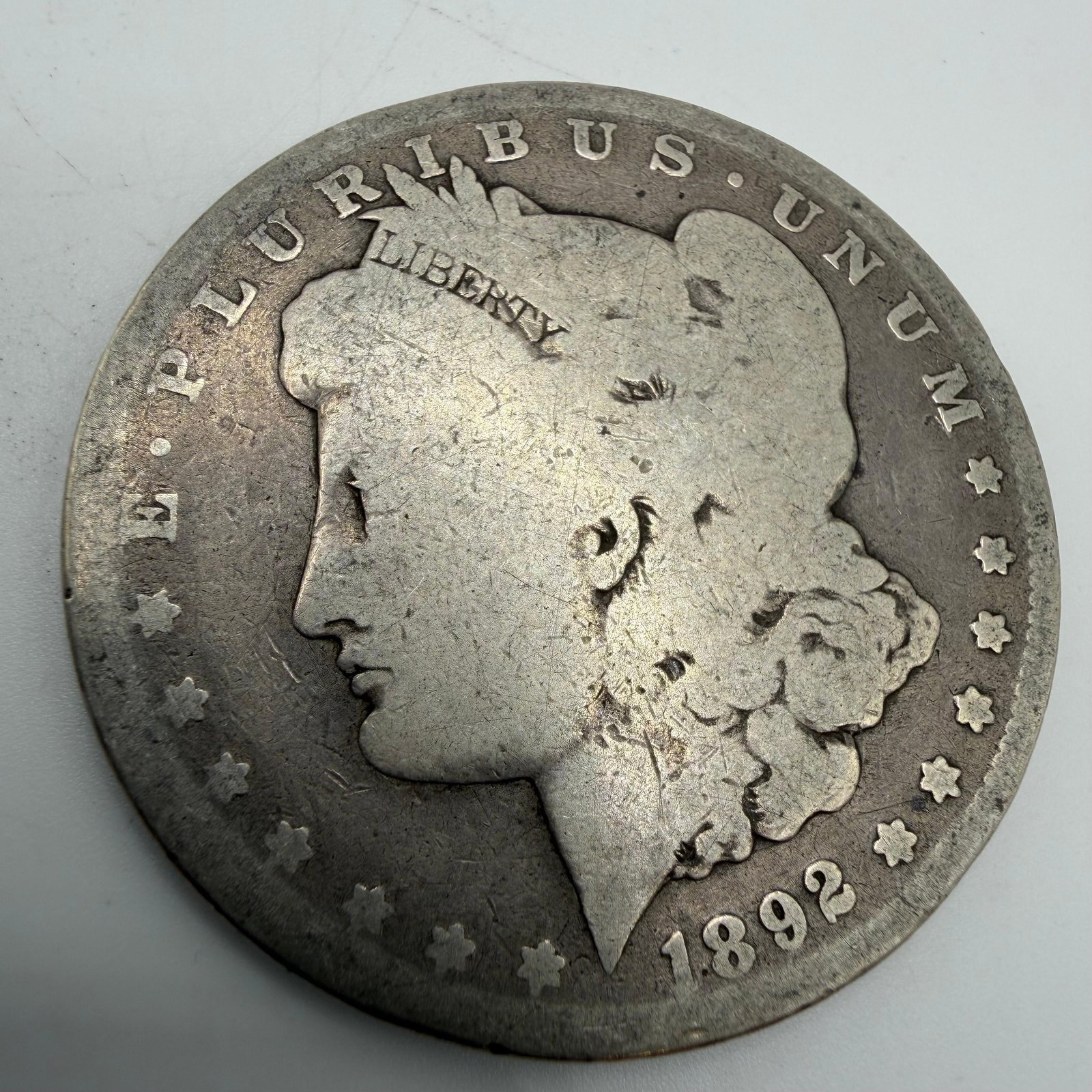 1892 Morgan Silver Dollar Coin: This coin has been carefully examined and researched before listing. Please view the photos, as they are a part of the condition. DETAILS: Metal - .900 Silver Tested - Yes Size - 1.5" Weight - 24.