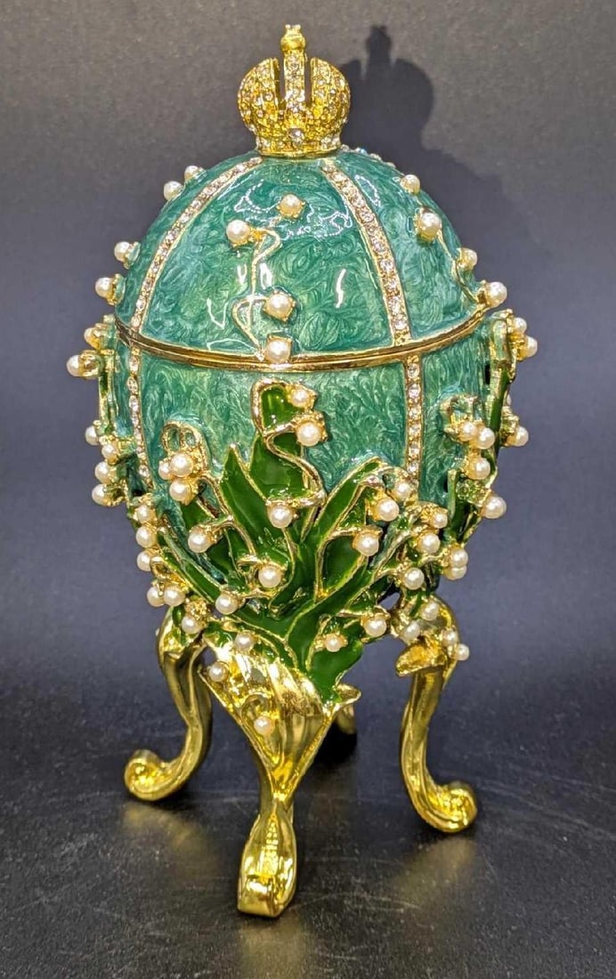 Sorelle Faberge Style Lilies of the Valley Egg Trinket Jewel Box: Sorelle Faberge Style Lilies of the Valley Egg Trinket Jewel Box. This is approx 6 1/4" x 3" x 3" and it weighs 1.39lb. There is some sticker residue inside the egg. Please see the images as the