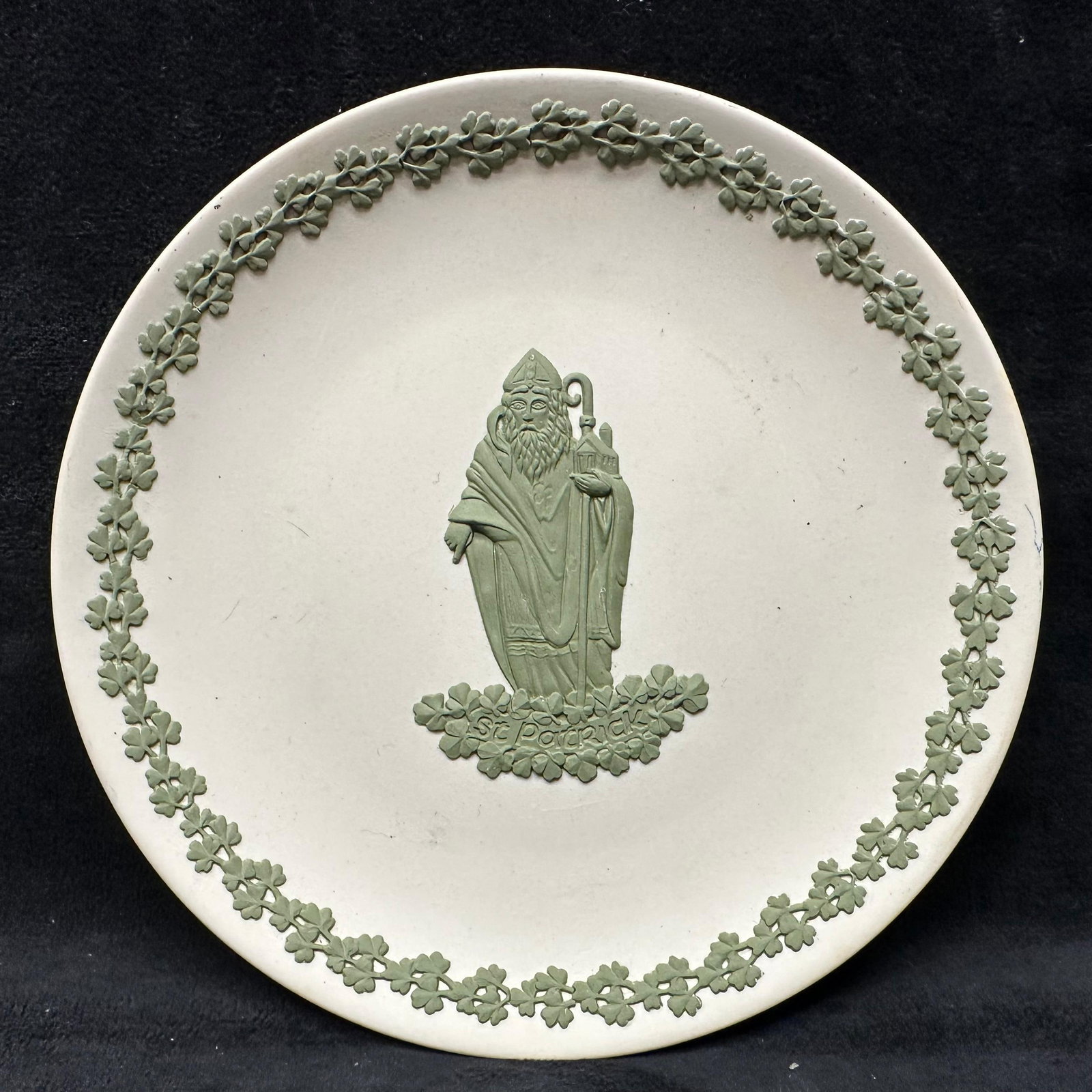 Green on White Jasperware Saint Patrick Wedgwood Plate: A green and white matte finish vase, Wedgwood, and their classic piece of pottery Jasperware range. Engraved on the bottom is Made in England, Wedgwood. The piece is green and white in color and