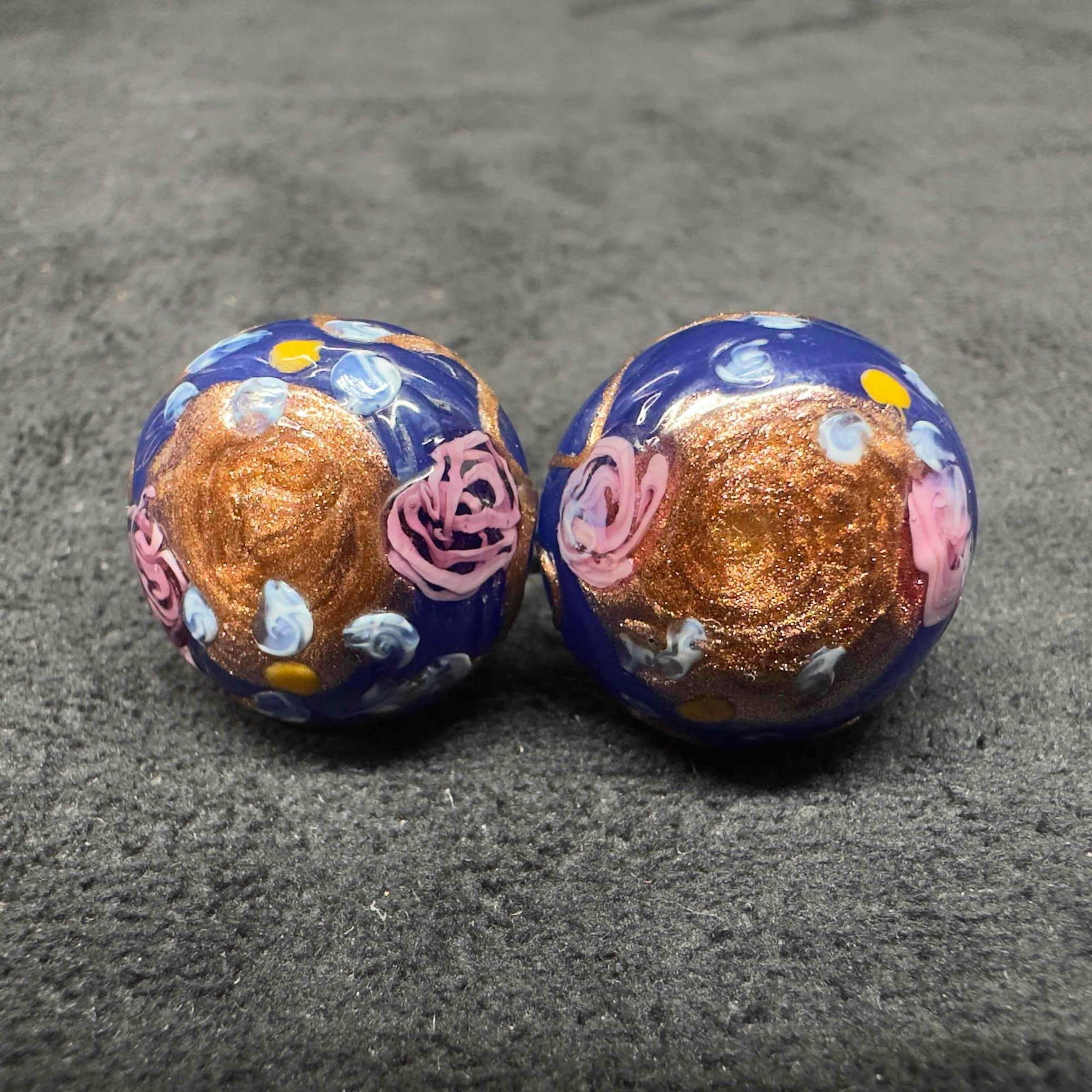 Murano Venetian Art Glass Lamp Work Dark Blue Floral Copper Accents Circle Bead Earrings F35: Murano Venetian Art Glass Lamp Work Dark Blue Floral Copper Accents Circle Bead Earrings F35. Earrings with dark blue glass beads with beautiful designs on each. The earrings feature floral and copper