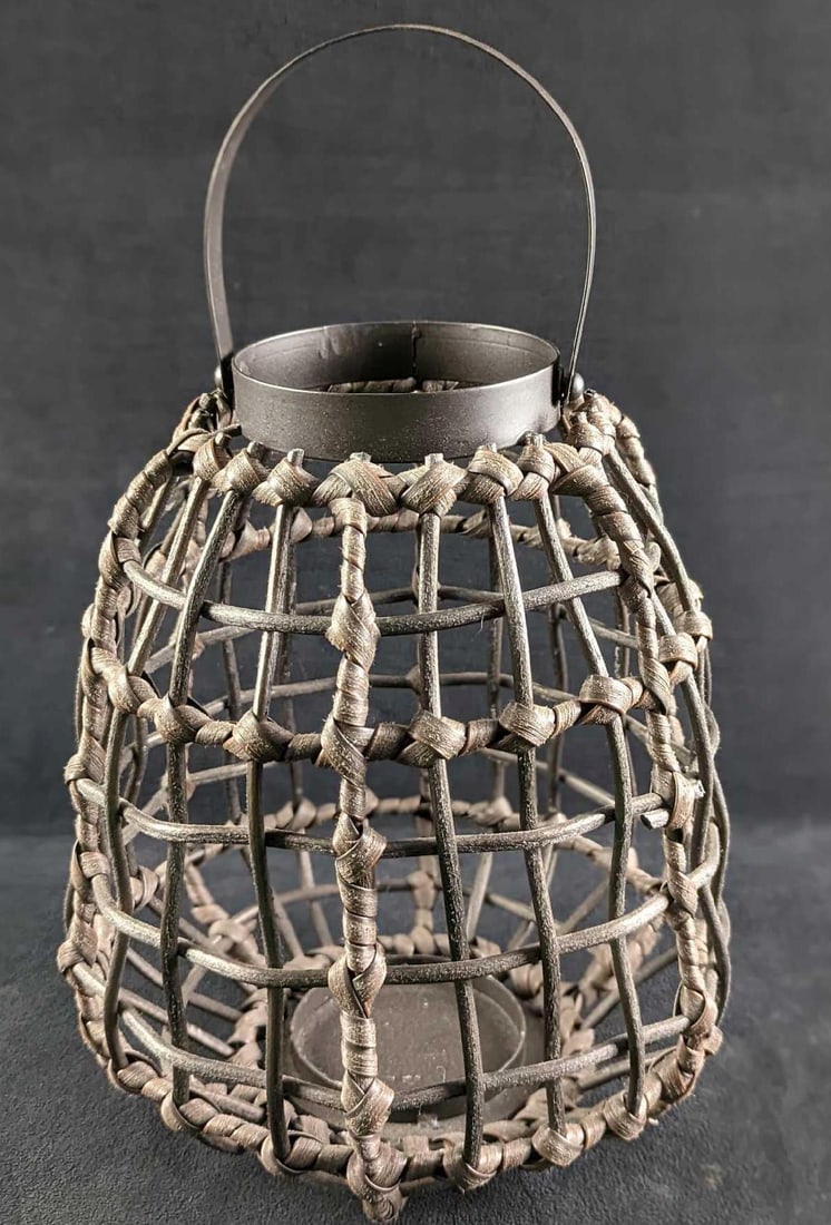 Plastic Wicker Like Basket Candle Holder: Plastic Wicker Like Basket Candle Holder. Is approx 9" x 9" x 12" (with handle down. 16" when up.) and it weighs 1.51lb. The basket is in a good, unused condition with some light wear. Please see the 