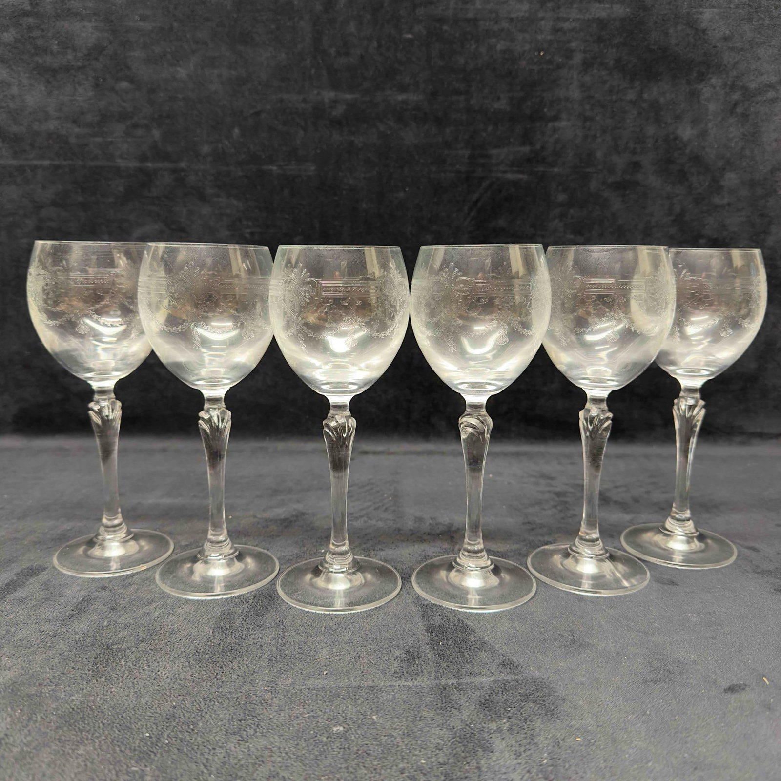 Six Clear Stemmed Wine Bohemia Style Crystal Glasses Etched Glassware Set: Six Clear Stemmed Wine Bohemia Style Crystal Glasses Etched Glassware Set. No chips, cracks, or breaks in the glasses. These items are in pre-owned, previously displayed condition with light