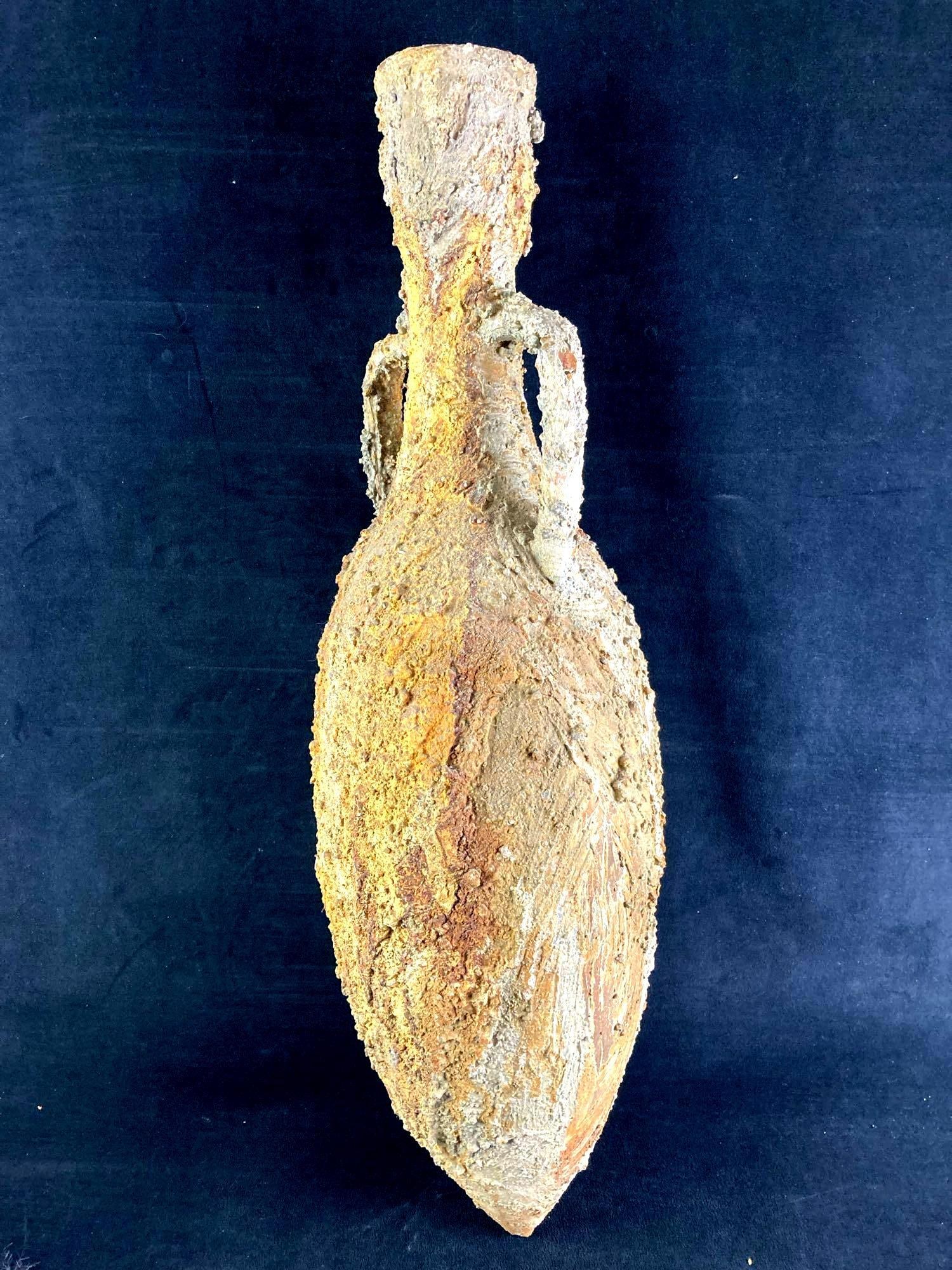 Antiquated Vase: Up for auction is a recent estate find, a antiquated ceramic vase. it is coated in clay or other material to give it a rough and aged appearance as if it were sitting on the ocean floor for a long per