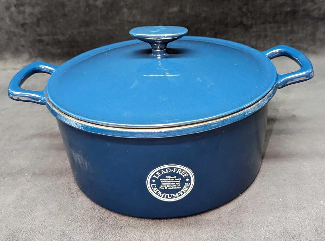Emeril Enameled Cast Iron Dutch Oven New In Box: Emeril Enameled Cast Iron Dutch Oven New In Box. "Real & Rustic - 6 QT Trinity Pot With Lid". This is approx 14 1/4" x 11" x 7". It comes in its original box that is approx 14" x 6" x 13" and it