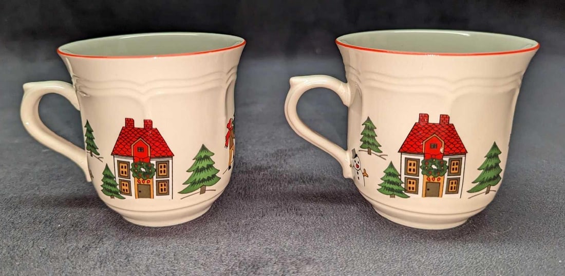 2 Retired Jamestown China Joy of Christmas Mugs B: 2 Retired Jamestown China Joy of Christmas Mugs B. Each is approx 4 1/4" x 3 1/4" x 3 1/4" and the total weight is 0.82lb. One of the mugs has a very small chip on one of the houses.