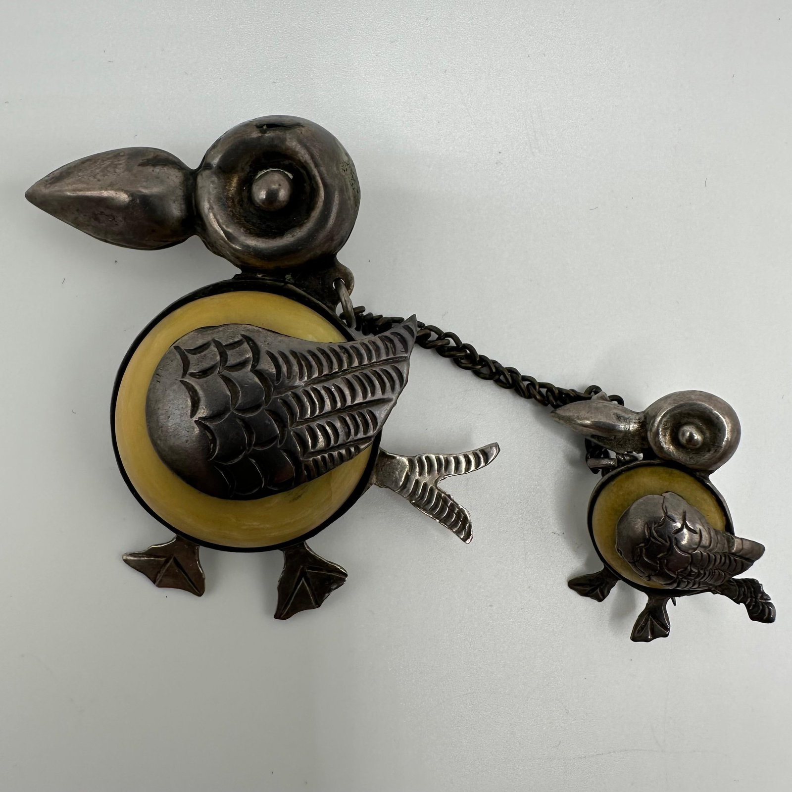Mexico Silver Brooch Toucan Bird Mother and Baby Stone Setting: This item is in good pre-owned, previously used/displayed condition with noticeable light wear and surface scratches. Please reference all photos for full details. This piece of jewelry has been teste