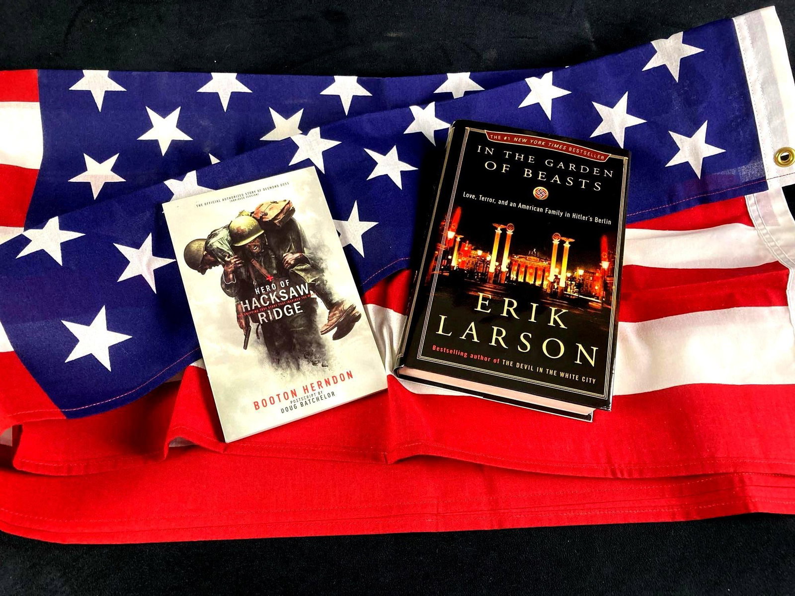 Polyester American Flag and (2) WWII Books: Up for auction is polyester American flag fresh an Air Force veteran's estate. It has brass grommets and has been folded. Its ready to display. Also a book titled Hero of Hacksaw Ridge w