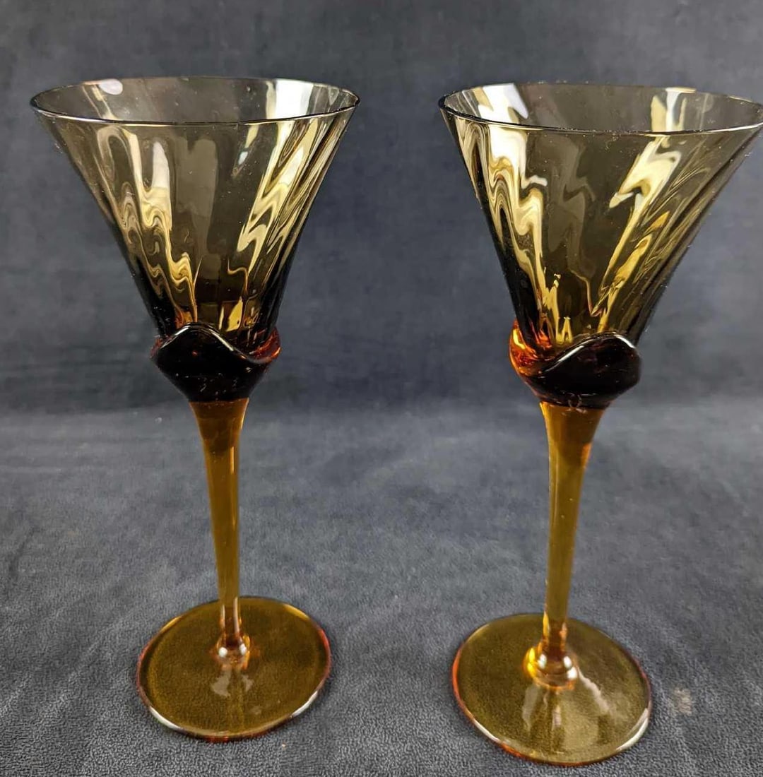 JB 2 Mikasa Amber Crystal Blossom Wine Glasses: This Lot Includes Two Mikasa Amber Crystal Blossom Wine Glasses. These were retired in the 1980s. Each glass is approx 4" x 4" x 9 1/4" and together they weigh 1.33lb. Each glass is in a good,