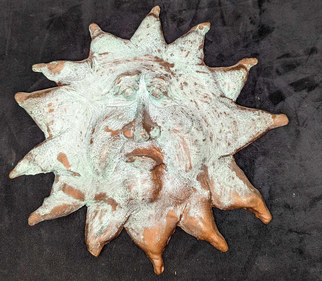 Vintage Wall Art Pottery Sun: Vintage Wall Art Pottery Sun. This is approx 14 1/2" x 2" x 14 1/4" and it weighs 1.06lb. This was given a glaze to make it look more like an aged bronze. One of the tips on the bottom left is broken 
