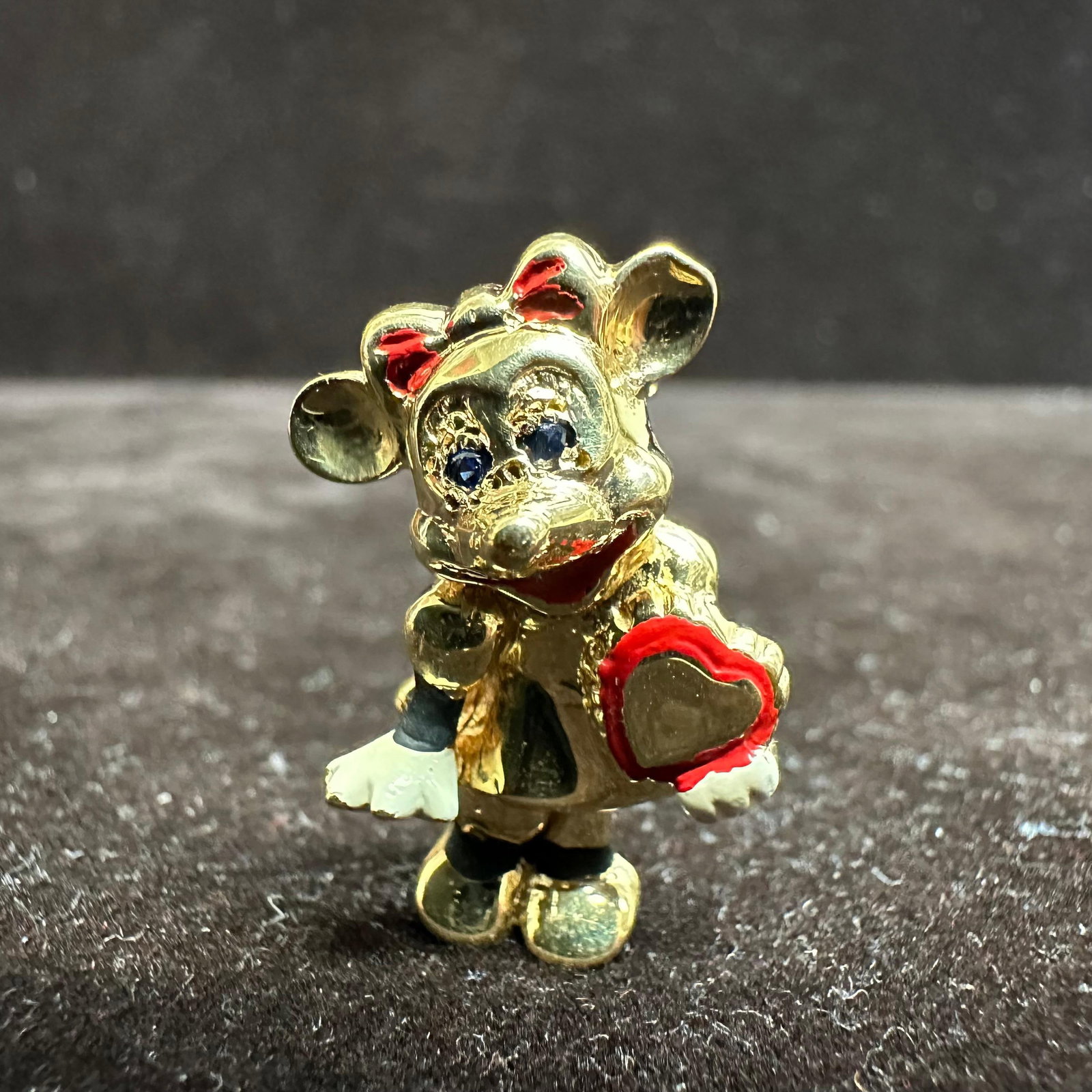 Walt Disney Productions Minnie Mouse 14K Blue Sapphire and Enamel Gold Brooch: This item is in good pre-owned, previously used/displayed condition with noticeable light wear and surface scratches. Please reference all photos for full details. This piece of jewelry has been teste