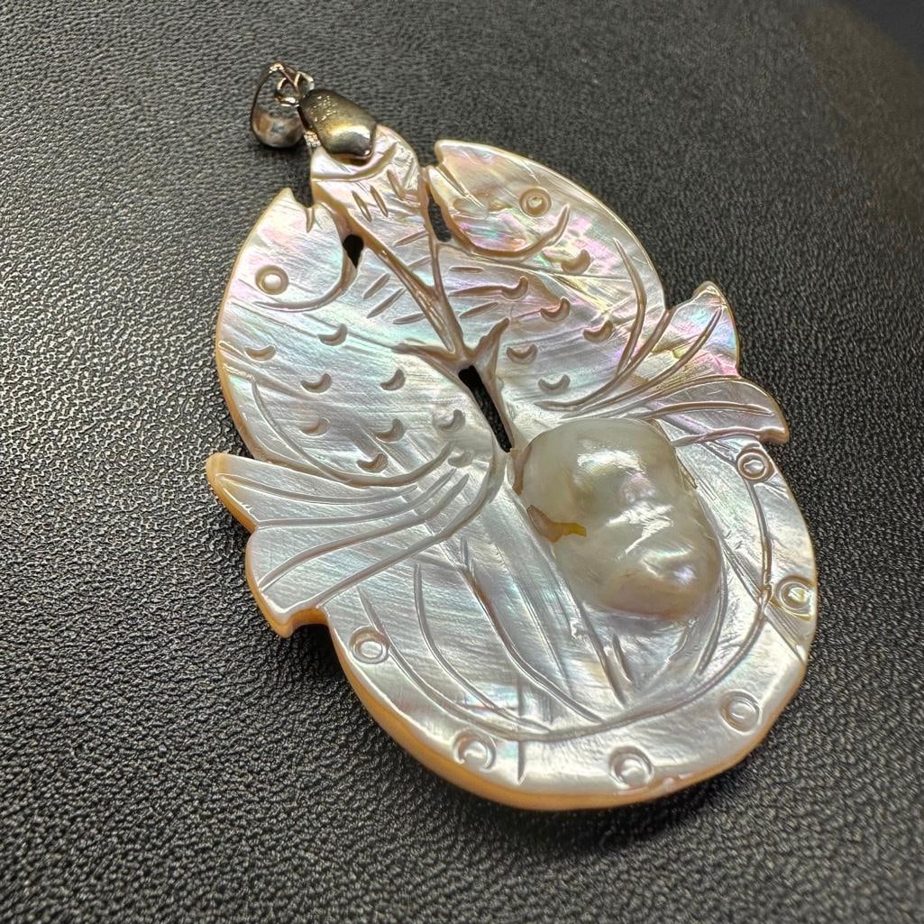 Hand-Carved Blister Pearl Pendant - Fish: This piece of jewelry has been tested and researched prior to listing. Please view all our pictures they are part of our description. DETAILS: Metal - Base Metal Color - Silver Stones - Blister