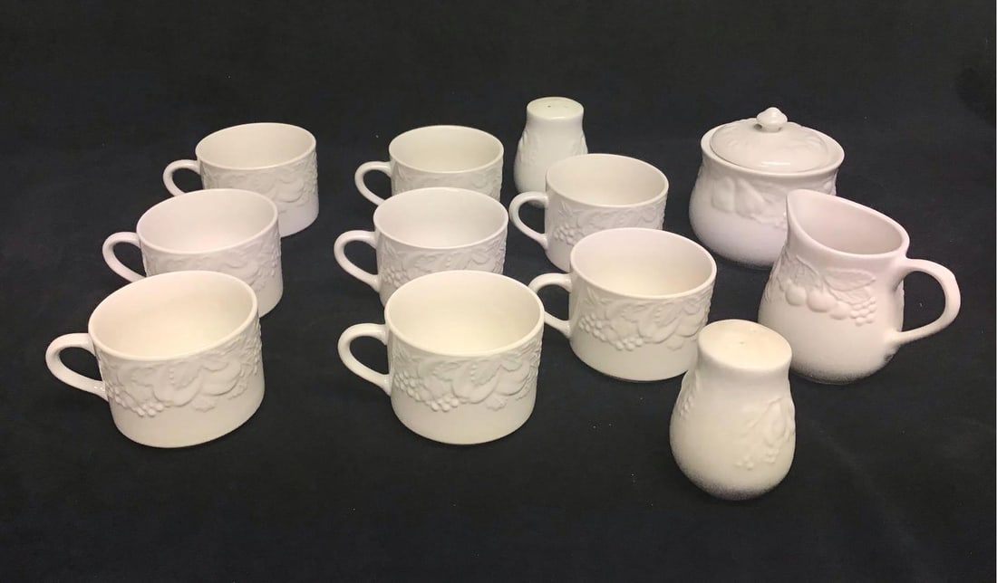 Lot of 12 Porcelain Tea Dining set from Fruit De Blanc 1995: This lot of Fruit De Blanc consists of the following; (1) 8 Cups with embossed fruit around the rim. These cups are great for casual drinks like tea, hot cocoa, coffee, ect. They have some known imper