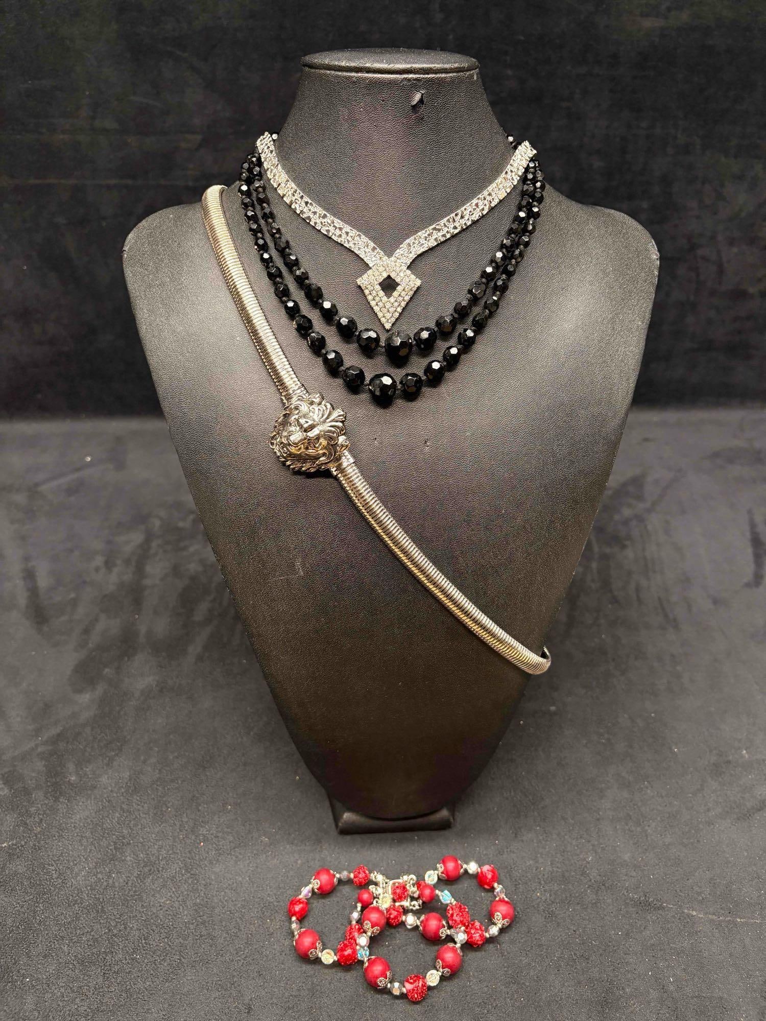4pc Red Black and Silver Lion Jewelry Lot: This lot consists of 3 pre-owned costume jewelry necklaces with typical wear from use. Please review images for context of the lots visual conditions. APPROX WEIGHT: 7.6 OZ