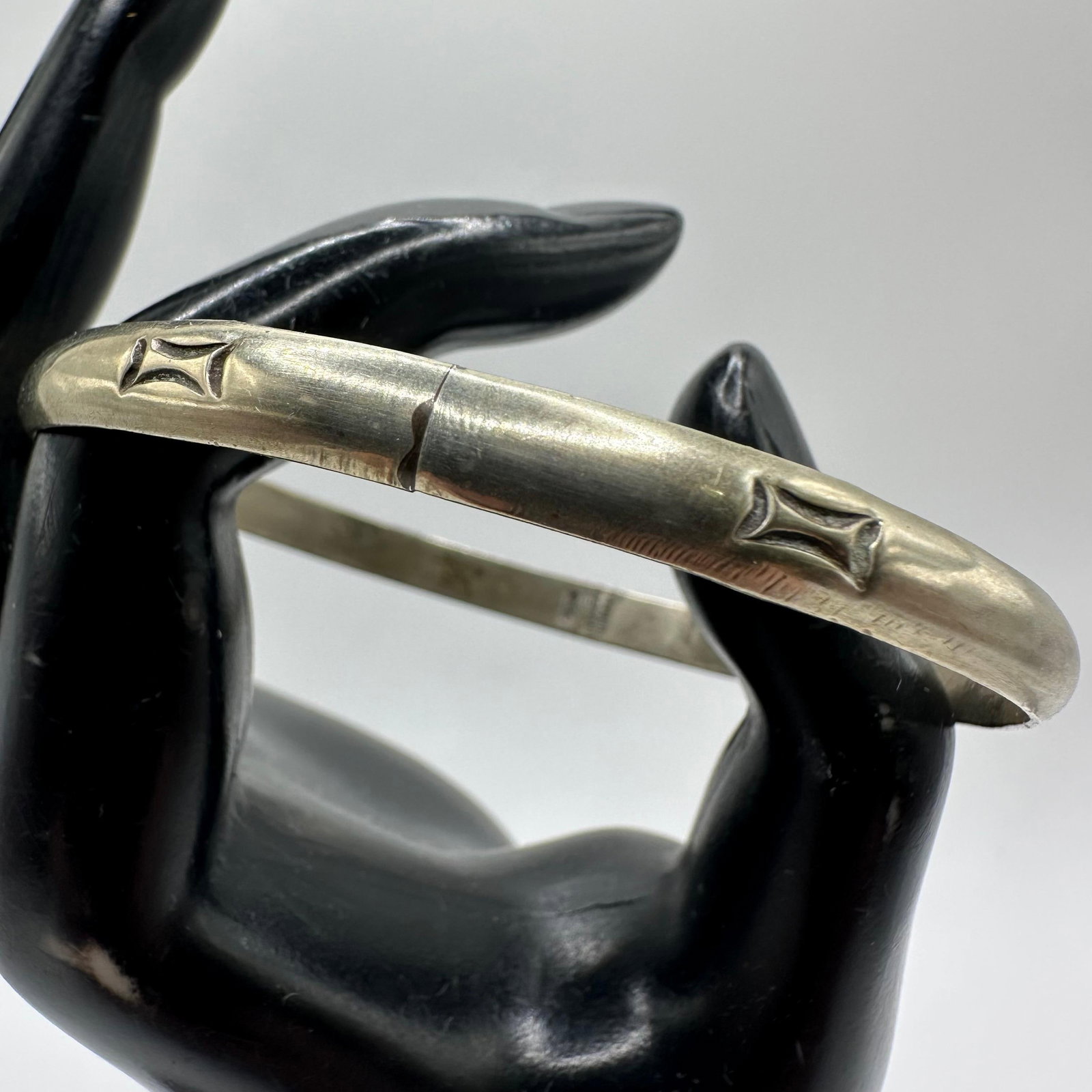 Sterling Taxco 925 Geometric Stamp Motif Silver Bangle Bracelet: This item is in good pre-owned, previously used/displayed condition with noticeable light wear and surface scratches. Please reference all photos for full details. This piece of jewelry has been teste