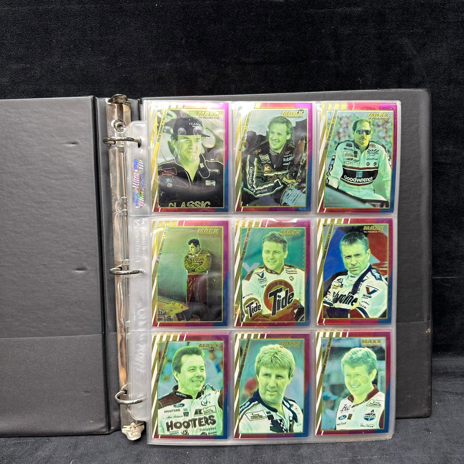 1990s Maxx NASCAR Premier Plus Racing Sport Trading Card Collection Blk Binder: Large collection of 1990s Maxx Premier Plus NASCAR trading cards housed in a 3-ring black binder with plastic sleeves. Includes numerous drivers, cars, and racing scenes. Cards appear in overall