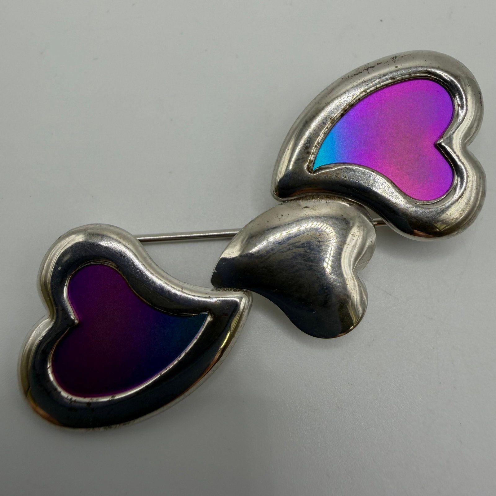 Triple Heart 925 Sterling Silver Brooch: This item is in good pre-owned, previously used/displayed condition with noticeable light wear and surface scratches. Please reference all photos for full details. This piece of jewelry has been teste