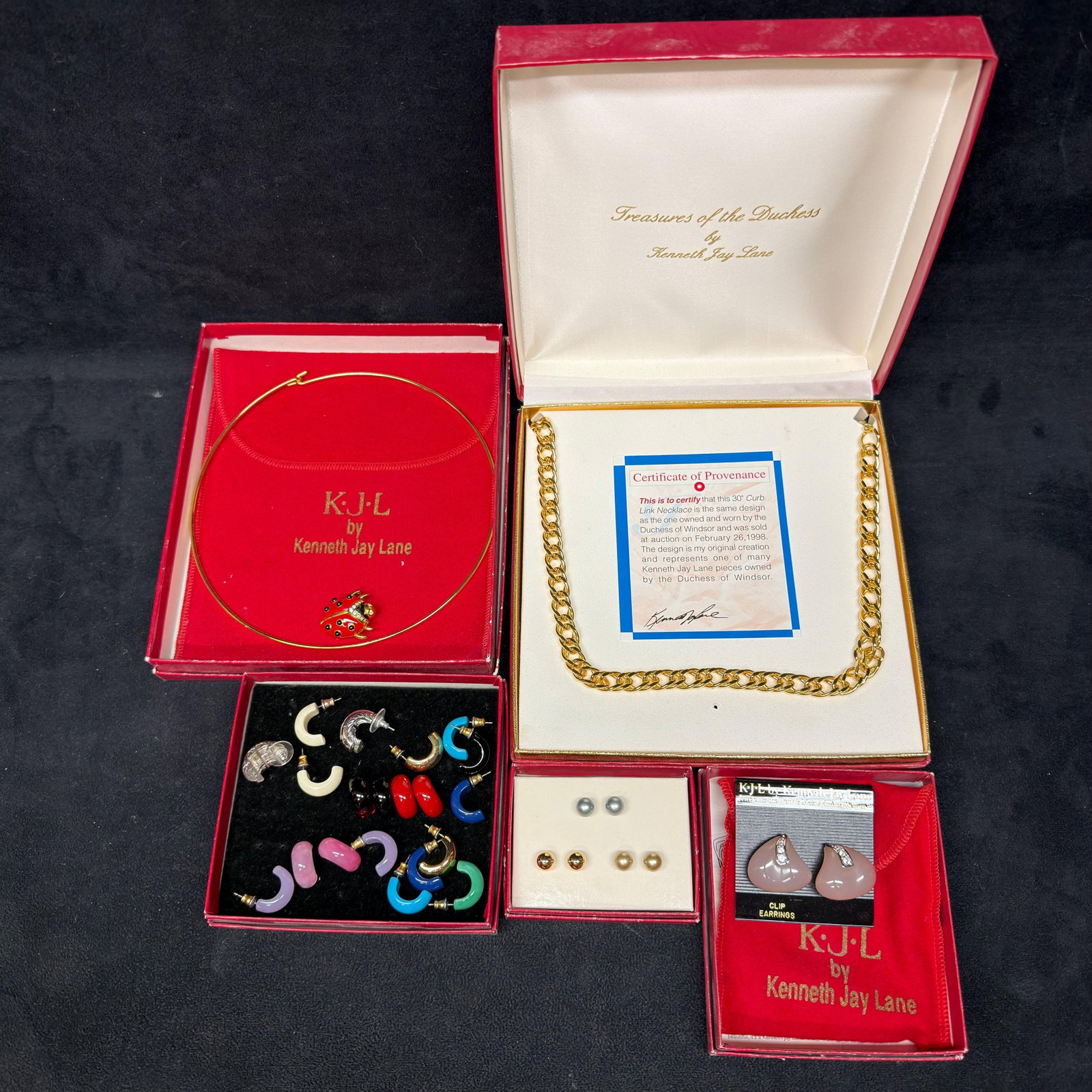 Kenneth Jay Lane Designer Costume Jewelry Collection Duchess Pieces and KJL Accessories: Large Kenneth Jay Lane (KJL) costume jewelry collection including a Treasures of the Duchess gold-tone curb link necklace, a pair of KJL multi colored resin interchangeable clip earrings, a ladybug pe