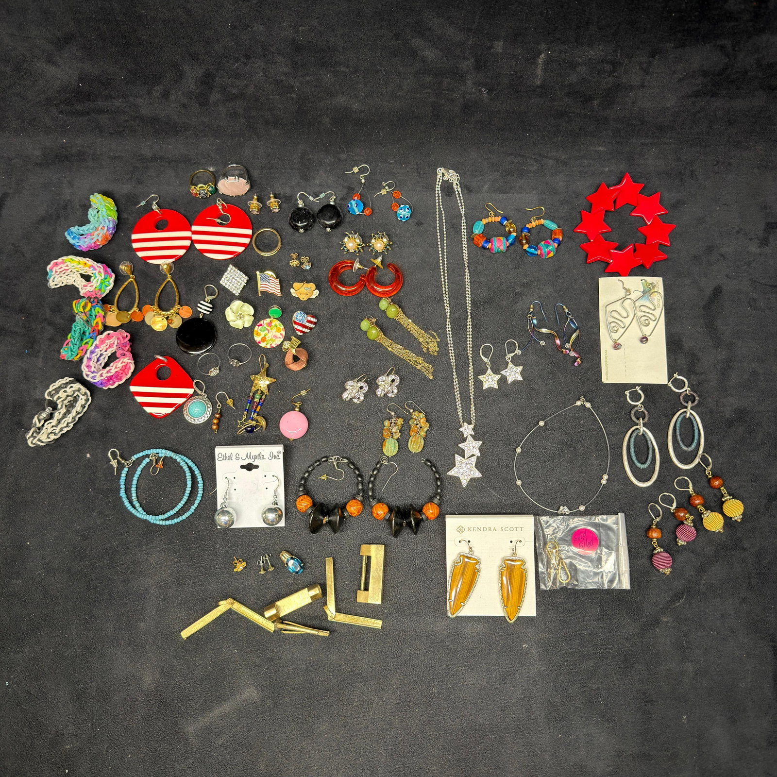Large Assorted Costume Jewelry Lot Earrings Necklaces Rings and Accessories: Large mixed lot of costume and fashion jewelry featuring a wide variety of earrings, necklaces, bracelets, rings, pendants, cufflinks, and accessories. Highlights include a pair of new-on-card Kendra 