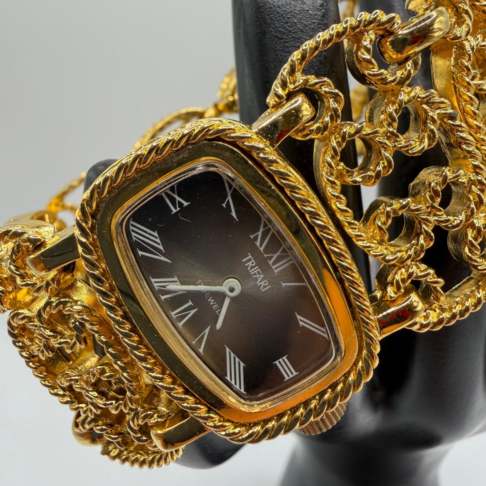Trifari Gold Tone Openwork Design Chain Watch with Box: Tested, running, working. Includes original box. This item is pre-owned, with light wear, minor imperfections, and surface scratches. Please reference all photos for full condition details. Size: