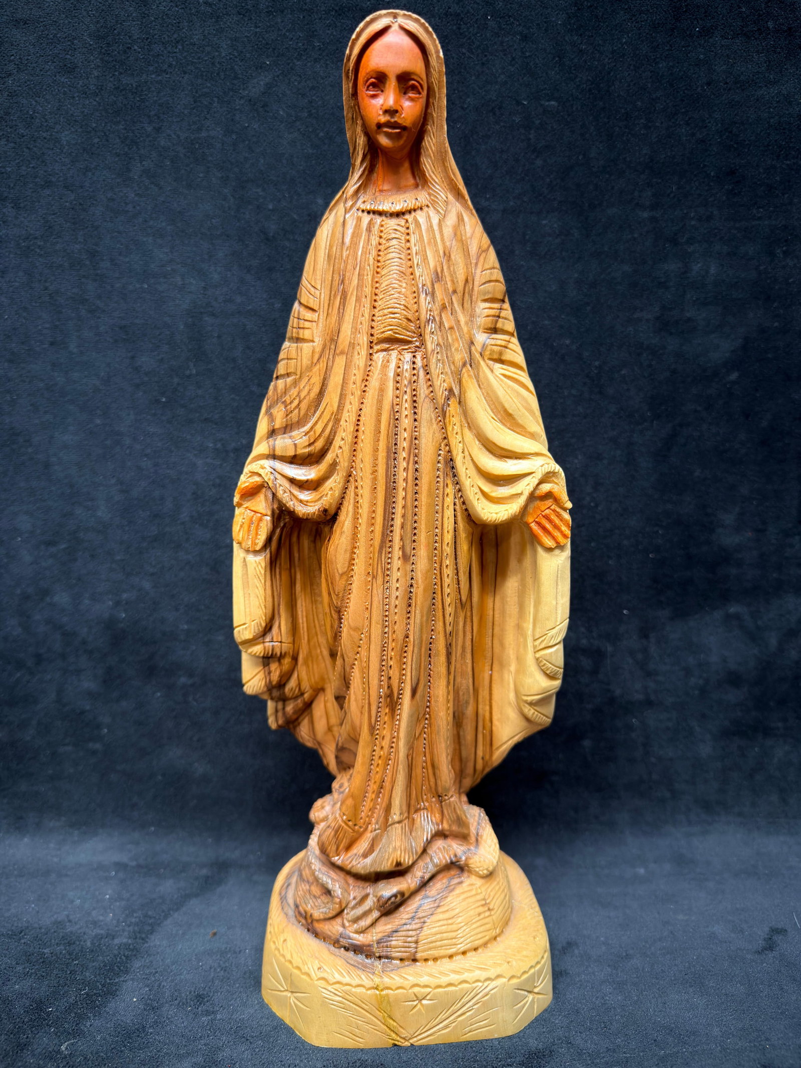 Hand Carved Olive Wood Madonna Figure Virgin Mary Serpent Religious Sculpture: Hand-carved olive wood figure depicting the Blessed Virgin Mary (Madonna) standing with open hands upon a serpent, a traditional representation of the Immaculate Conception. The carving showcases