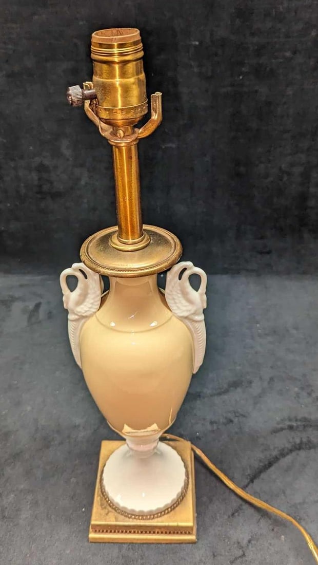 Vintage Art Deco Style Double Swan Porcelain Lamp: Vintage Art Deco Style Double Swan Porcelain Lamp. This is approx 5" x 4" x 17 3/4" and it weighs 3.84 lbs. The lamp was tested and it works. It does not come with a lampshade, light bulb, or lamp har