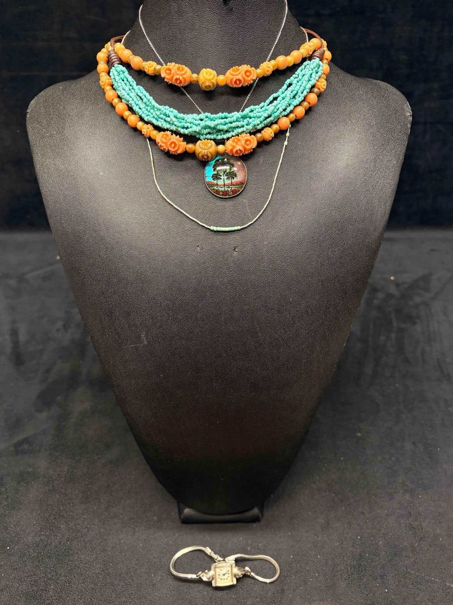5pc Retro Surfer Jewelry Set: This lot consists of 5 pre-owned costume jewelry necklaces with typical wear from use. Please review images for context of the lots visual conditions. APPROX. WEIGHT: 2.3 OZ