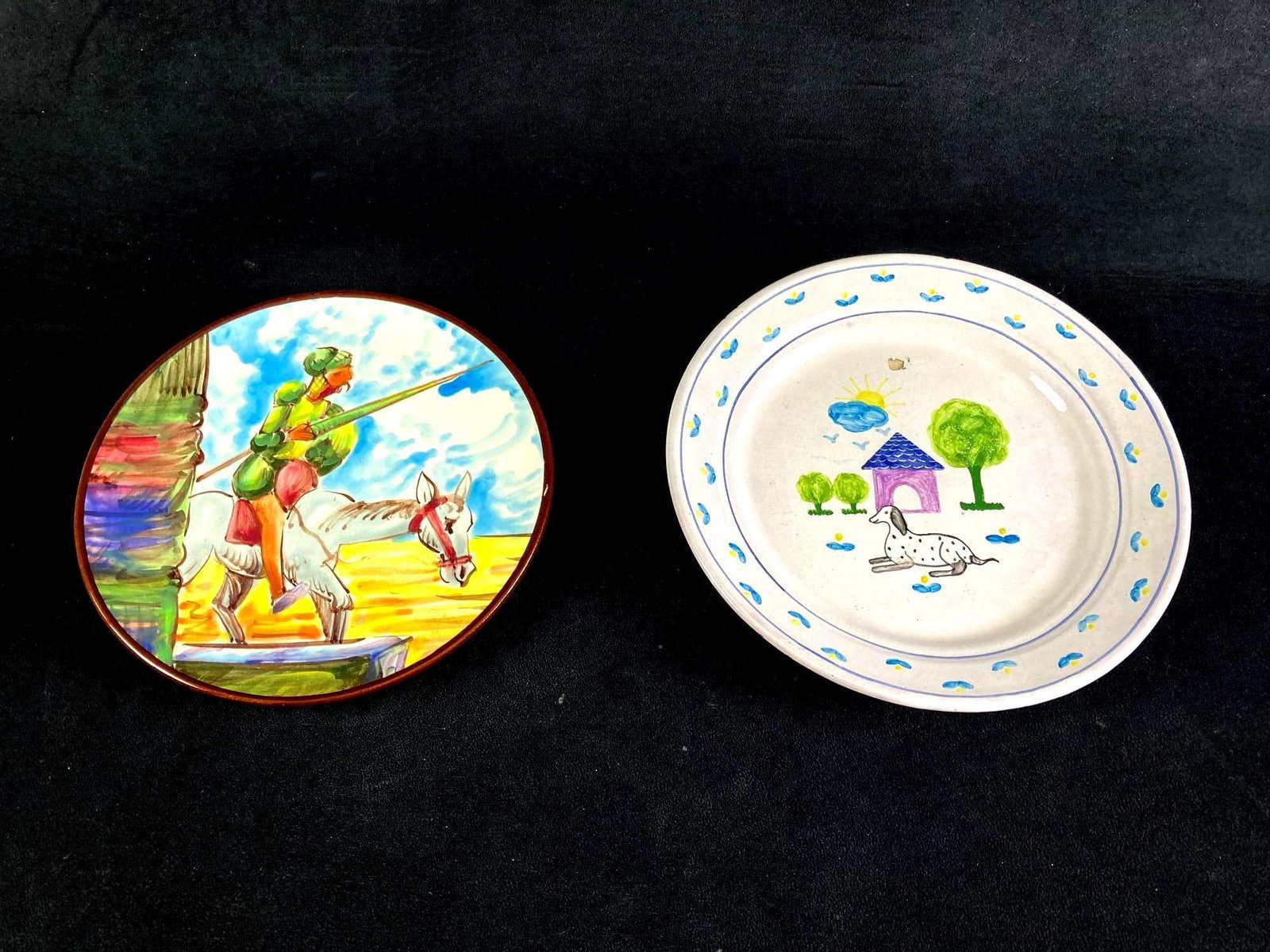 Set of (2) Portuguese Plates Various Designs: Up for auction are recent estate finds, a set of (2) Portuguese plates with various designs. One has a knight riding a horse in a jousting tournament and the other has a dog in front of a house and