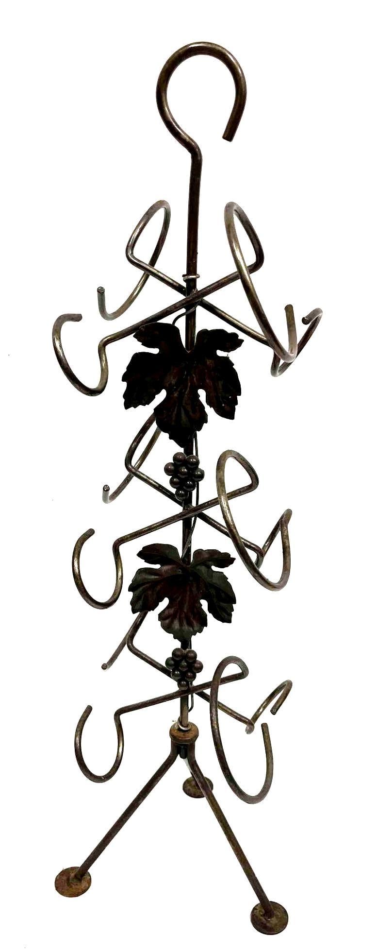 Portable Metal 6 Bottle Wine Stand Grape Leaf & Vine Design: This lot contains a Portable Metal 6 Bottle Wine Stand Grape Leaf & Vine Design. It is approx 8 3/4" x 8 3/4" x 27 3/4" and it weighs about 3lbs. Overall the wine stand is in good used condition with