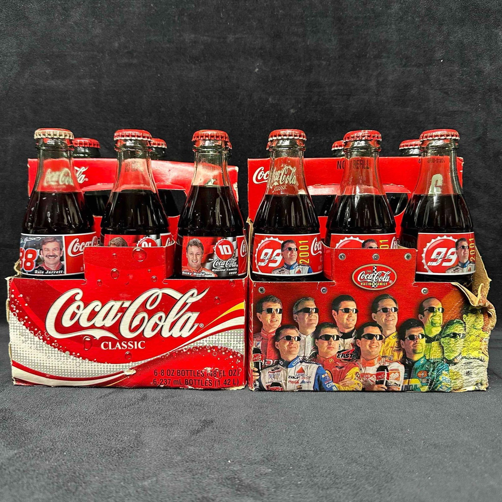 Coca Cola NASCAR Racing Collectible Six Pack Set 8oz Bottles: Coca Cola NASCAR Racing Collectible Six Pack Set 8oz Bottles. This set includes two six pack Coca Cola 8oz. bottles themed to several NASCAR driver's. This item is in pre-owned, previously